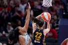 Indiana Fever guard Caitlin Clark (22) was held to nine points in the Indiana fever's home opener.