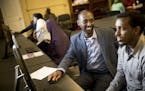 Mohamud Noor, left, helped Daud Abshir apply for a job at Amazon, in Minneapolis. "Why not combine our separate efforts and do a better collaborative 