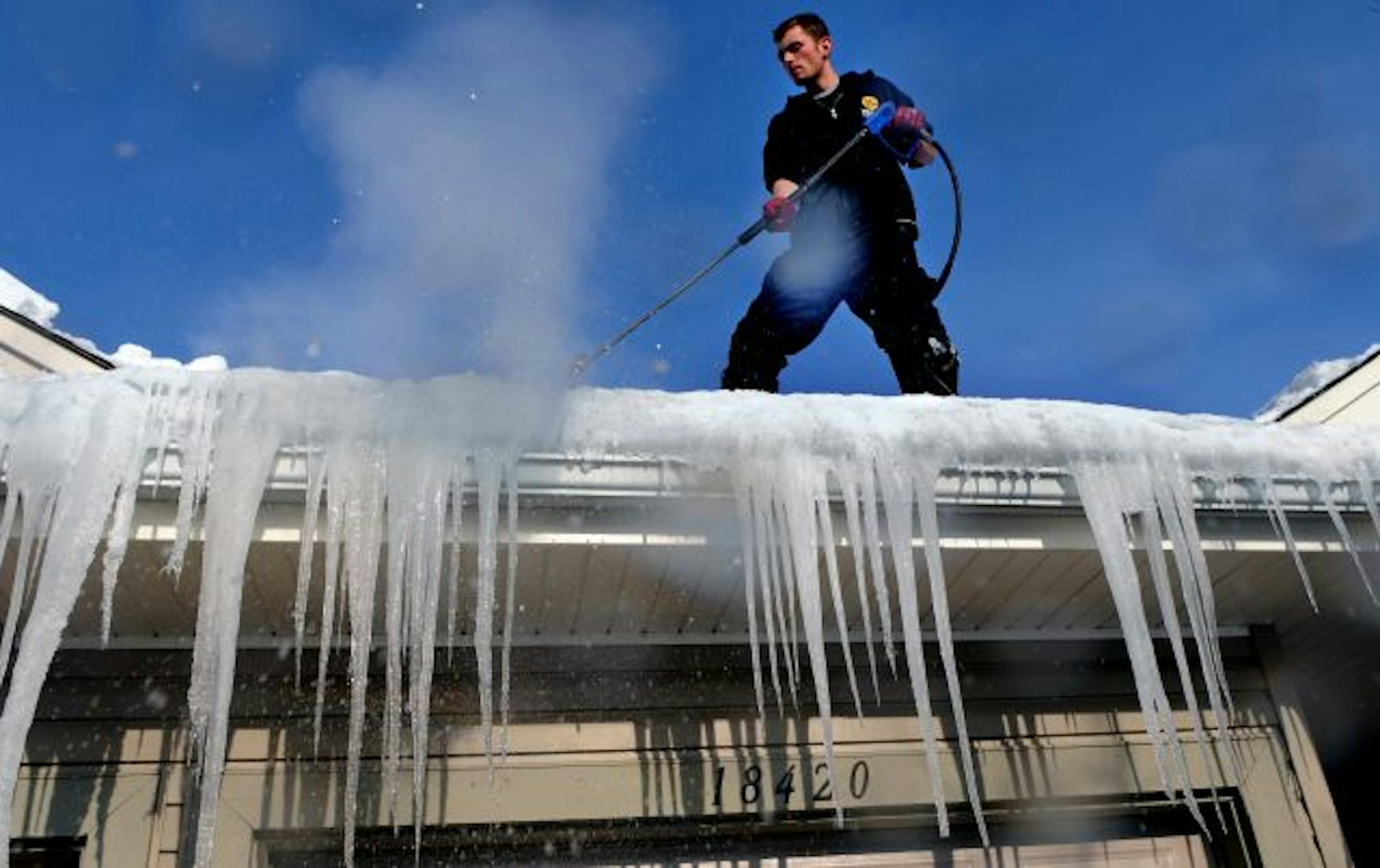 The ice dams are the worst in decades because of the early and record setting snow falls. Shawn Kelly of the Ice Dam Company used steam spray to clear away an ice dam on a roof of a house at 18000 block of Creek Bend Dr. in Minnetonka.