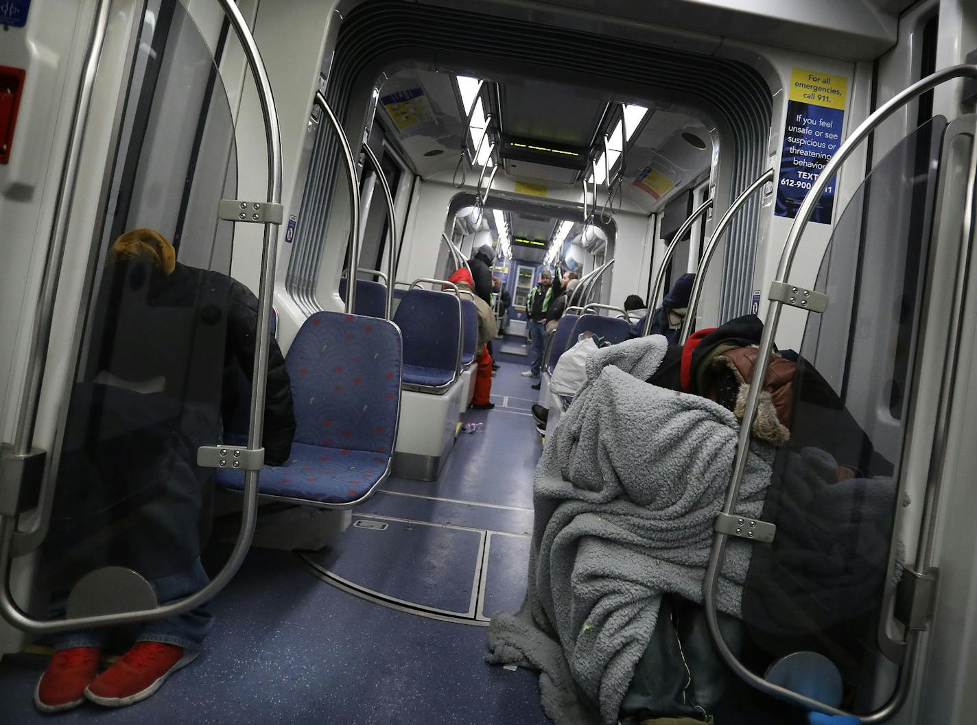 People slept on a Blue Line train heading to downtown Minneapolis on Thursday. Rider safety is a growing concern on the trains.