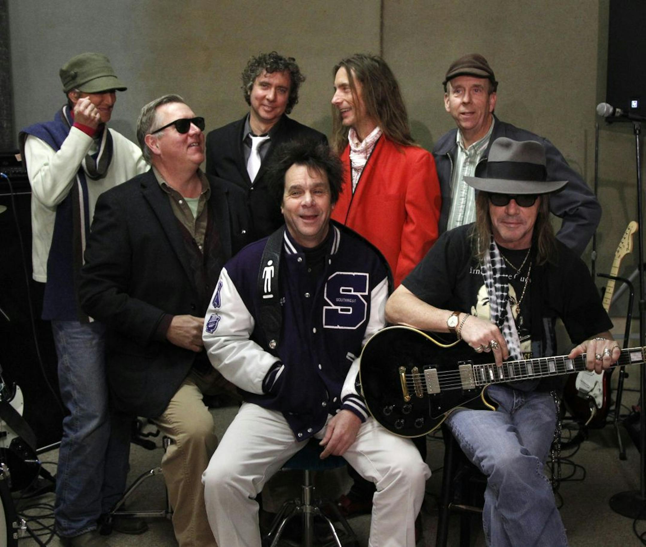 The Suburbs, from left, Rochelle Becker, Chan Poling, Michael Halliday, tie, Hugo Klaers, letter jacket, Steve Brantseg, red jacket, Max Ray, back and John "Beej" Chaney, Shades were photographed during a rehearsal last week in North Minneapolis. He and the band were getting ready for another round of Suburbs reunions, and he's back in the studio recordings for the first time in years. [ TOM WALLACE • twallace@startribune.com_ Assignment_#20020565A_ November 11, 2011 _ SLUG: burbs1118_ EXTRA INF