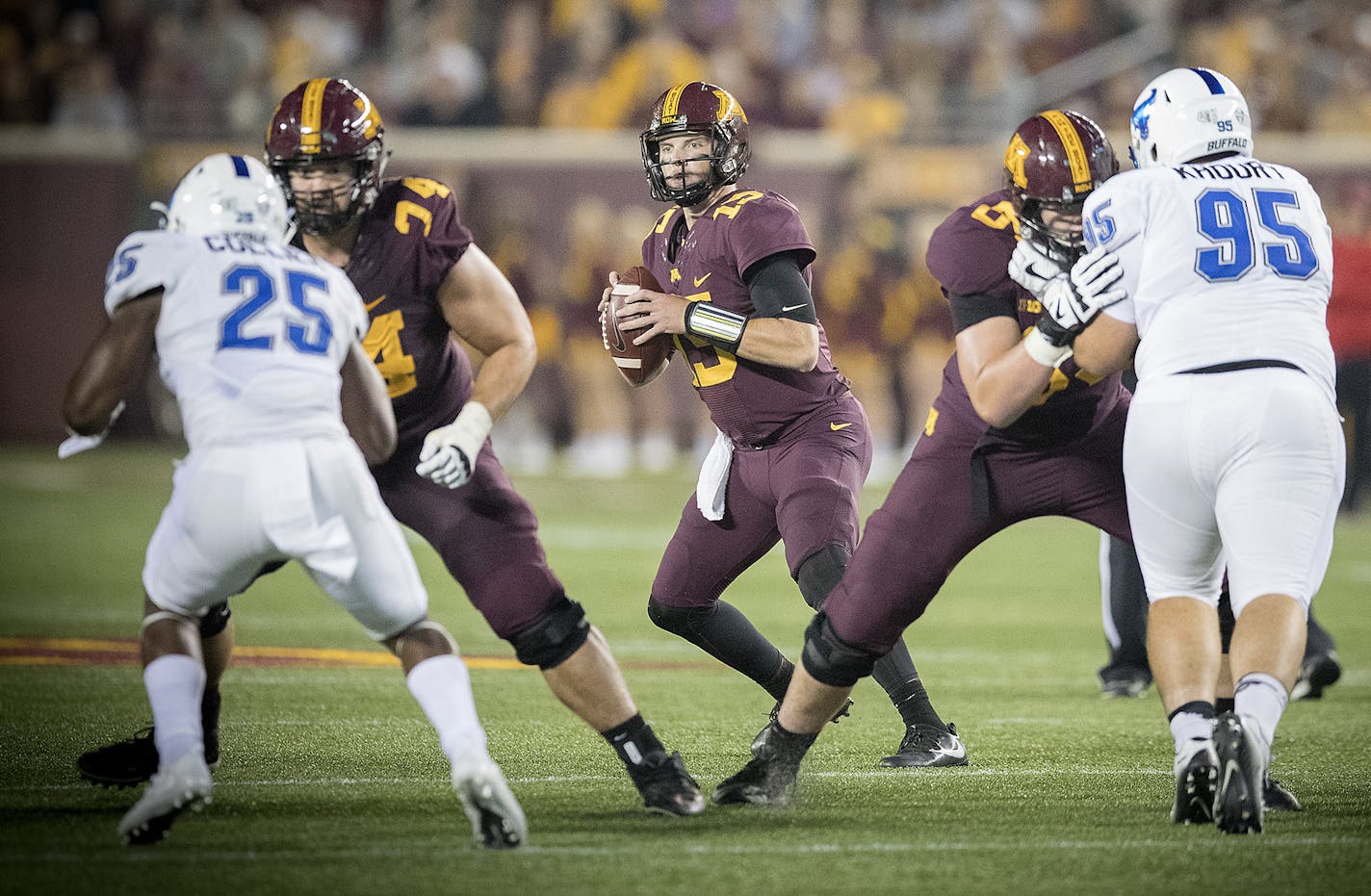 Minnesota quarterback Conor Rhoda looked downfield to pass during the fourth quarter.