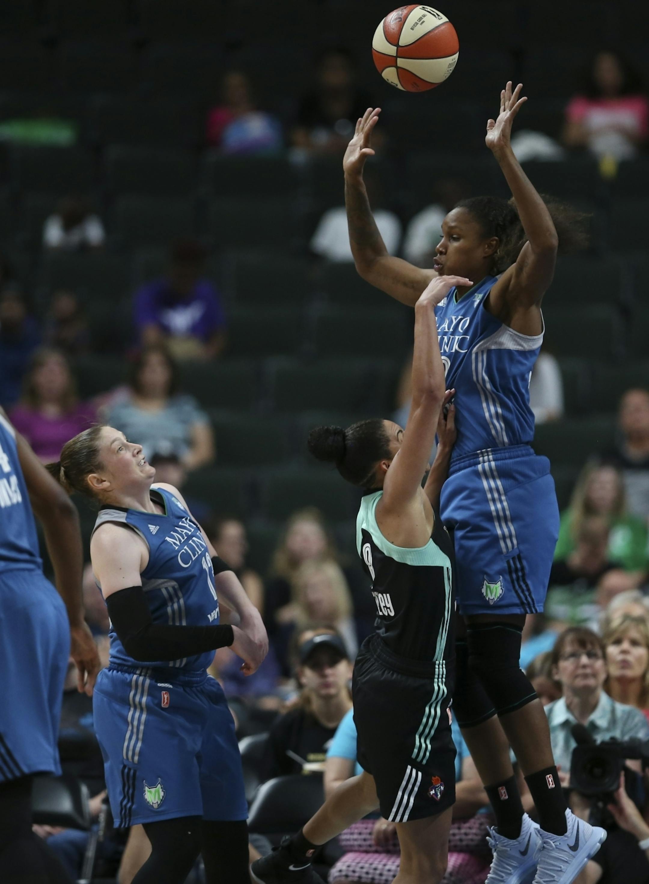 New York Liberty guard Bria Hartley (8) rain into the defense of Minnesota Lynx forward Rebekkah Brunson (32) in the second quarter while Lindsay Whalen (13) was ready for the loose ball.