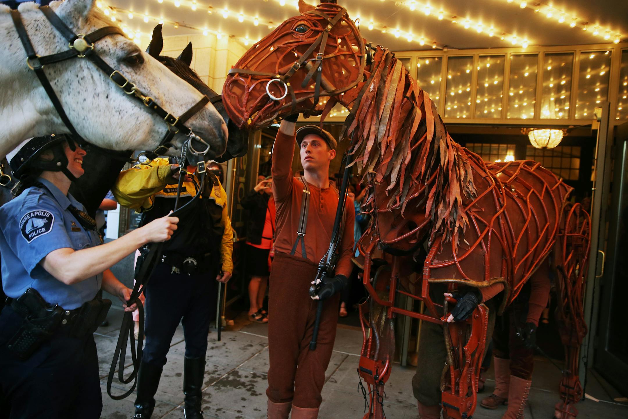 At the Orpheum Theater in downtown Minneapolis, two of Minneapolis' finest equine members encountered Joey of "War Horse." Officer Robin Waggoner met actor and puppeteer Jon Riddleberger.