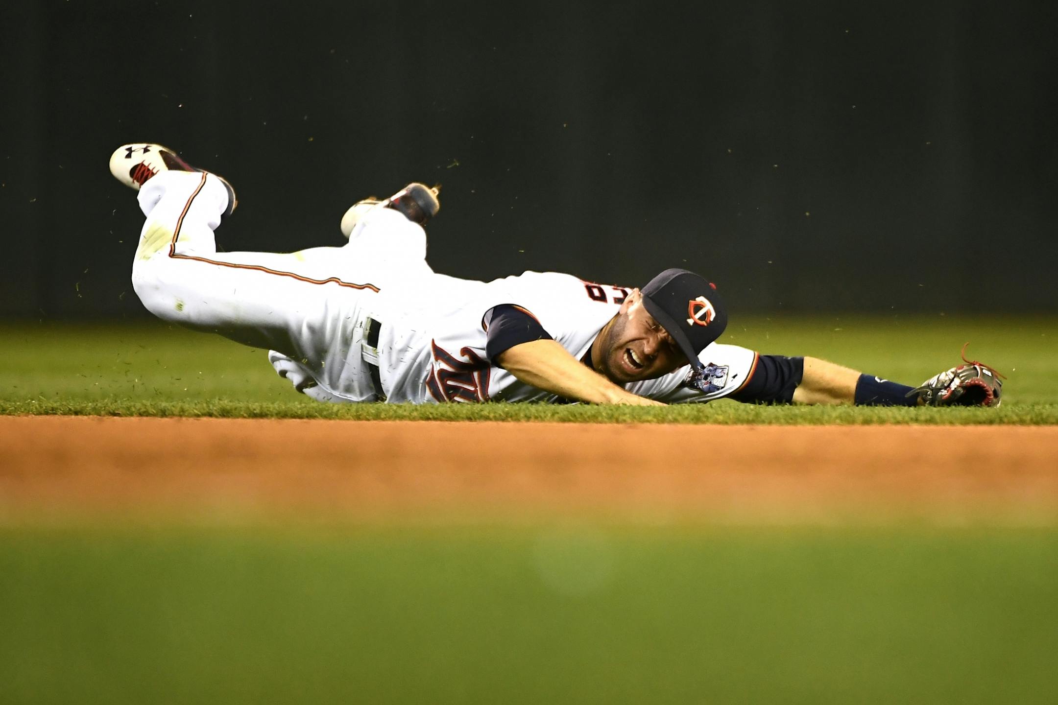 Minnesota Twins second baseman Brian Dozier (2) couldn't handle a line drive by Martin Prado in Thursday's loss to Miami.