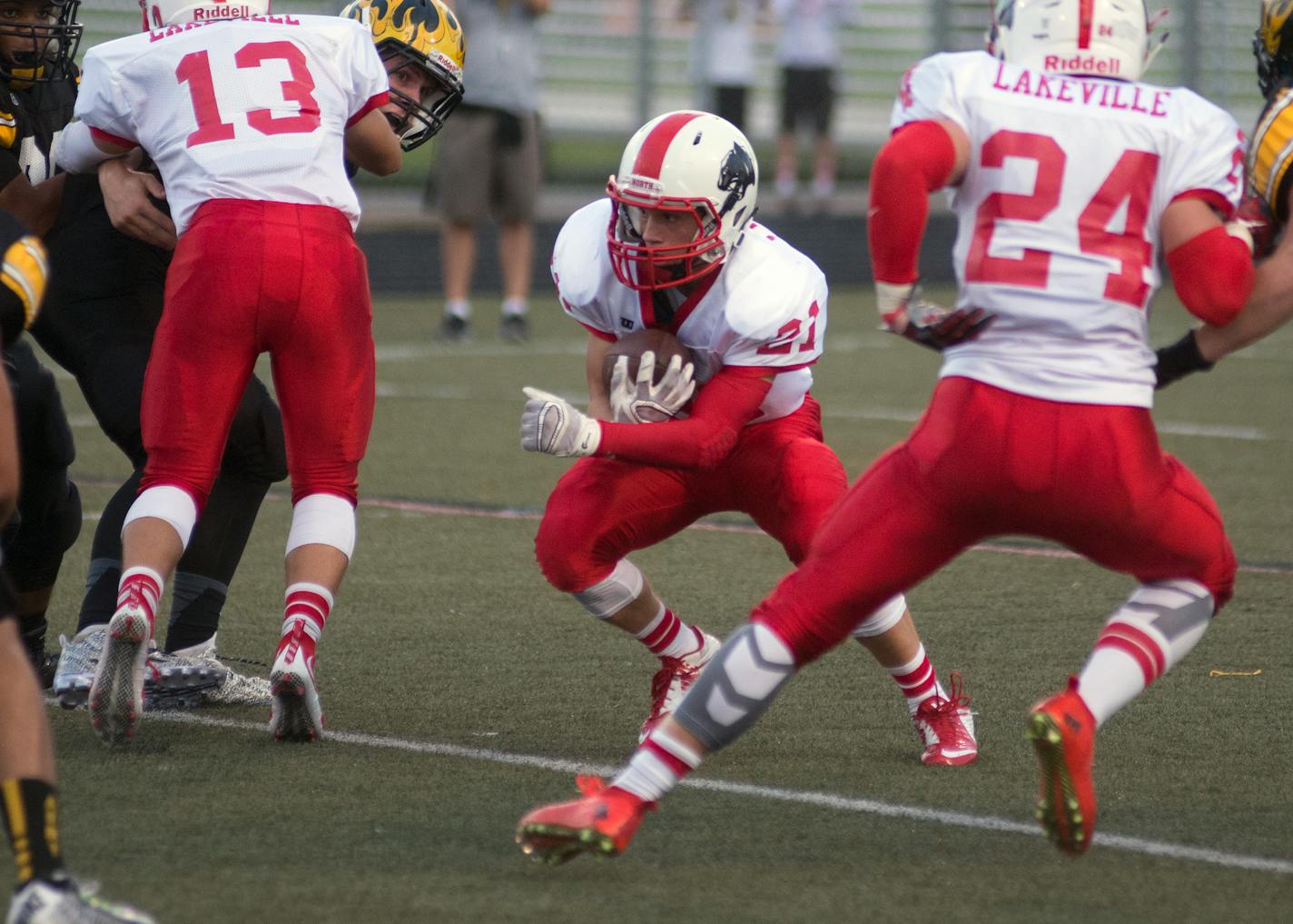 Lakeville North's Wade Sullivan found a hole on a run in the second quarter against Burnsville on Friday. Thanks in part to a huge game by Sullivan, Lakeville North won 29-18.