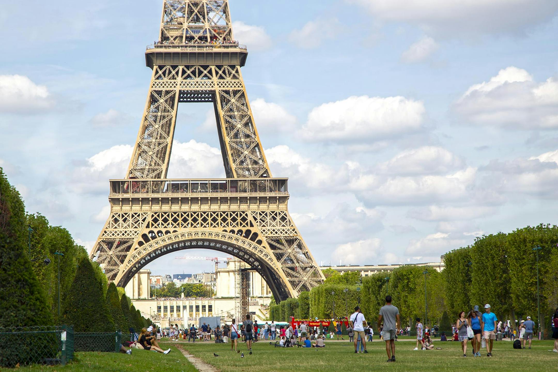 The Eiffel tower on Champ de Mars with tourists around the park on a cloudy Paris summer day in August 2019. (Juan Garcia Hinojosa Pacheco/Dreamstime/TNS) ORG XMIT: 54053840W