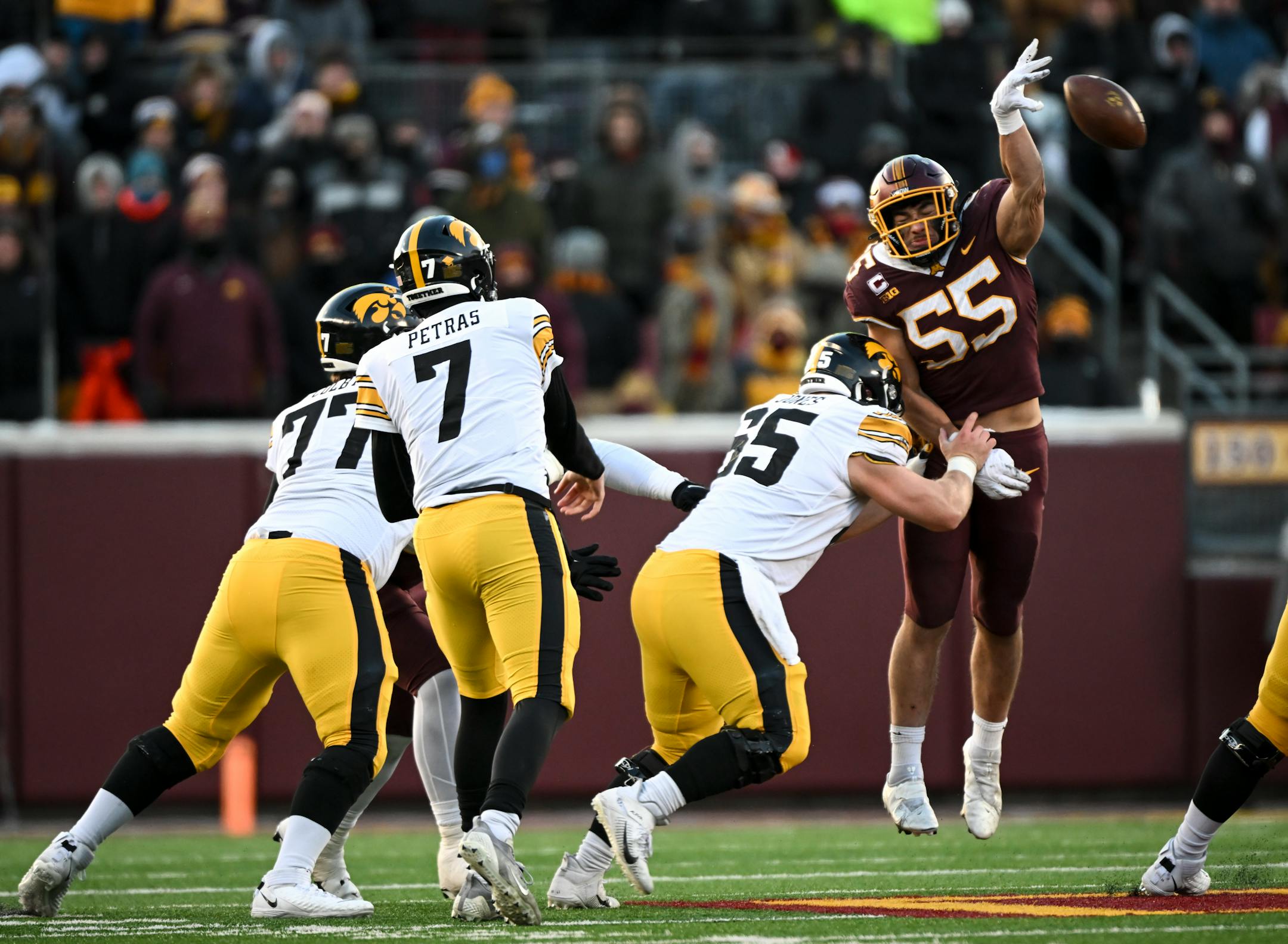 Minnesota Gophers linebacker Mariano Sori-Marin (55) tips a pass by Iowa Hawkeyes quarterback Spencer Petras (7) during the first half.