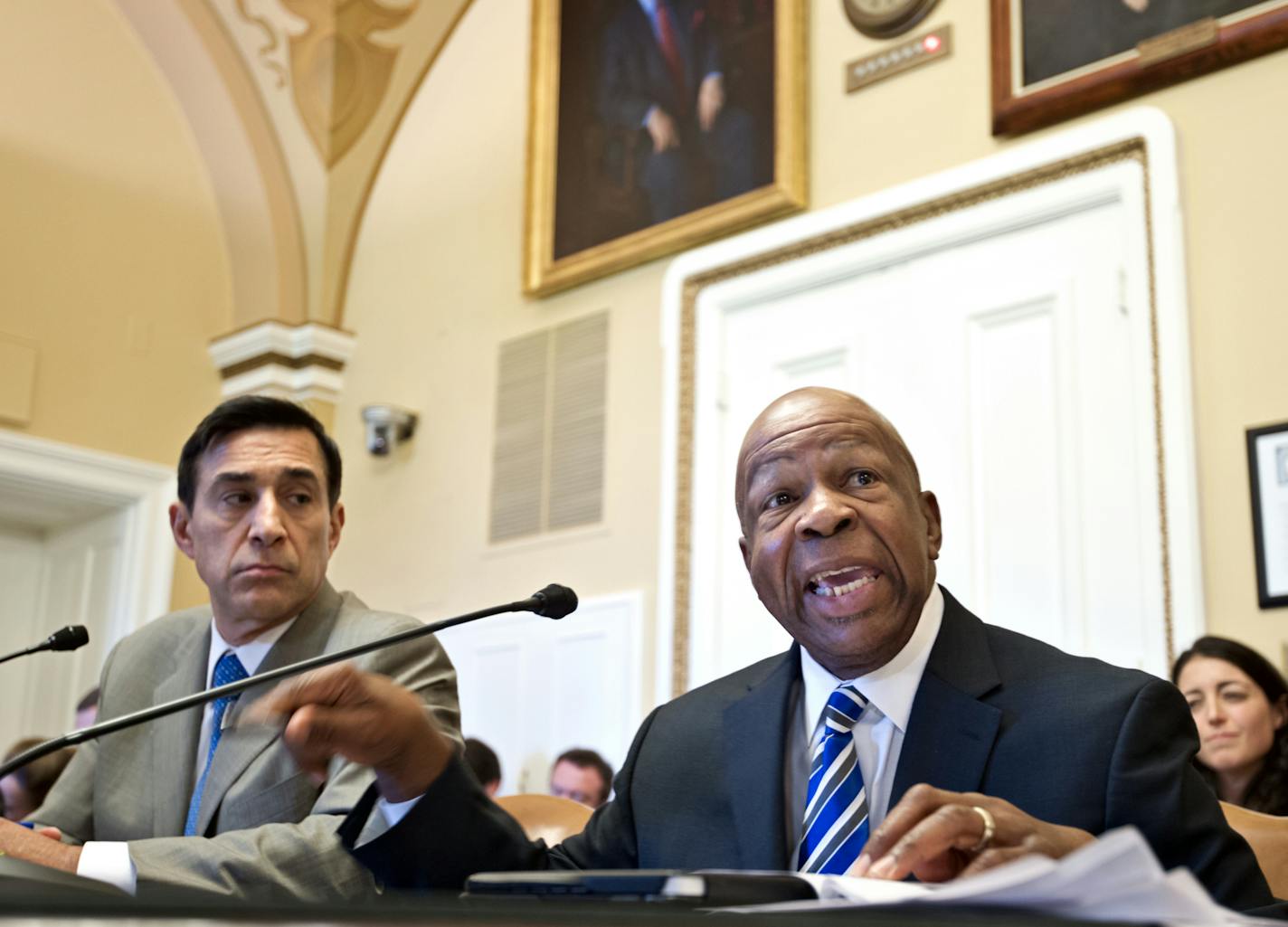 House Oversight and Government Reform Committee Chairman Rep. Darrell Issa, R-Calif., left, and the committee's ranking Democrat Rep. Elijah Cummings, D-Md., go to the House Rules Committee, on Capitol Hill in Washington, Wednesday, June 27, 2012, to argue procedures as the House of Representatives prepares to vote on whether Attorney General Eric Holder is in contempt of Congress because he has refused to give the Oversight Committee all the documents it wants related to Operation Fast and Furi