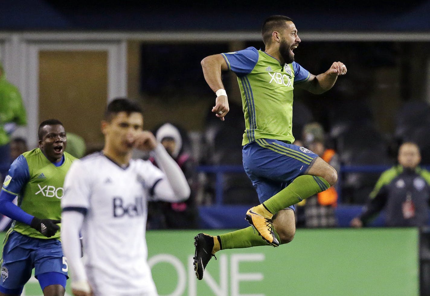 Seattle Sounders' Clint Dempsey leaps after scoring the first of his two goals against the Vancouver Whitecaps, during the second half of the second leg of an MLS soccer Western Conference semifinal. Thursday, Nov. 2, 2017, in Seattle. The Sounders won 2-0. (AP Photo/Elaine Thompson)