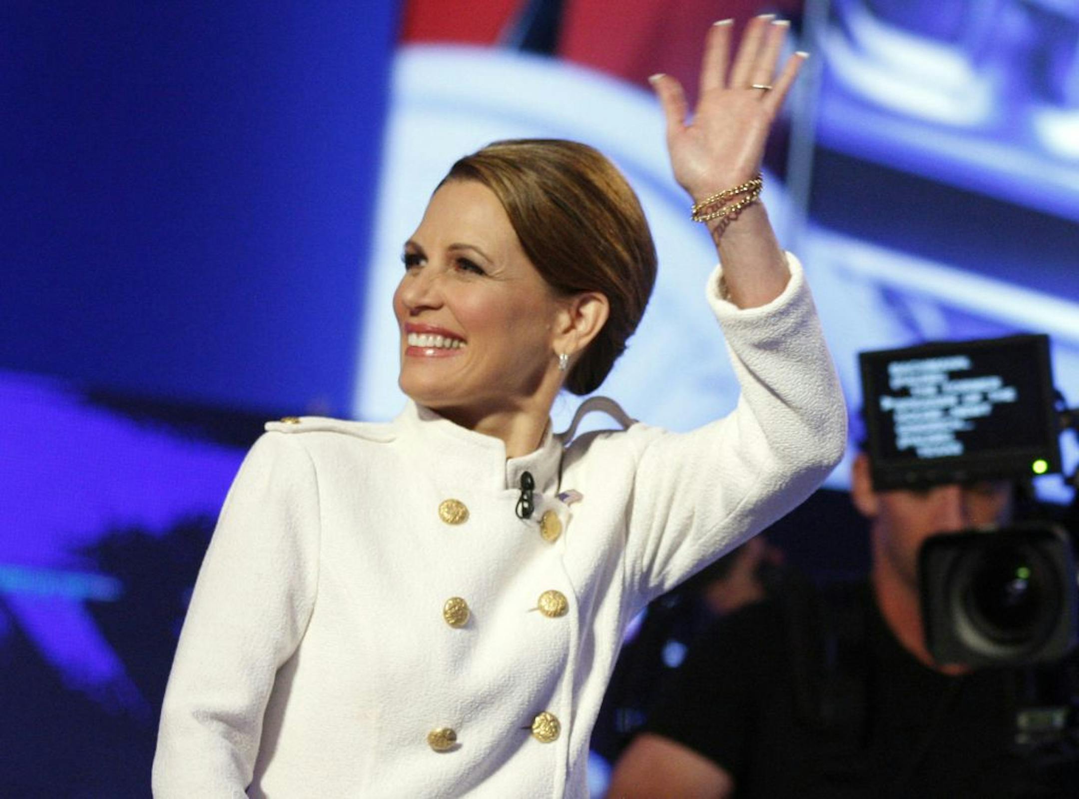 Republican presidential candidate Rep. Michele Bachmann, R-Minn., waves to the crowd before a Republican presidential debate Tuesday, Oct. 18, 2011, in Las Vegas.