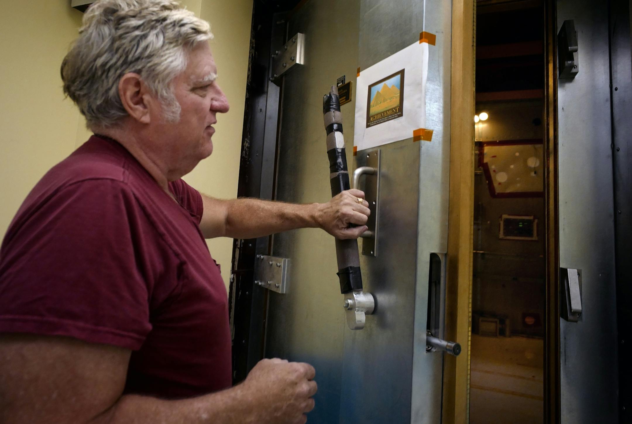 Soudan Underground Laboratory manager Meier opens the vault to the CDMSII experiment vault which housed instruments to detect dark matter. That experiment also shut down.