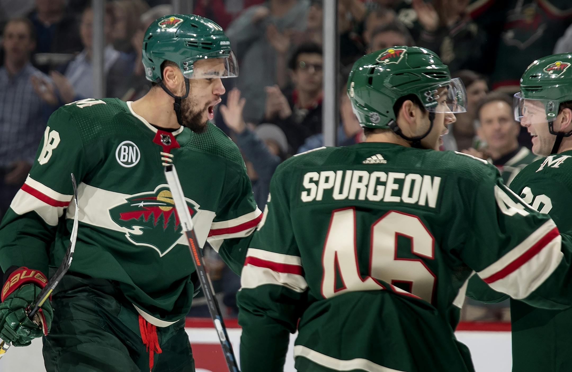 Jordan Greenway (18) celebrated with teammates after scoring a goal in the first period.