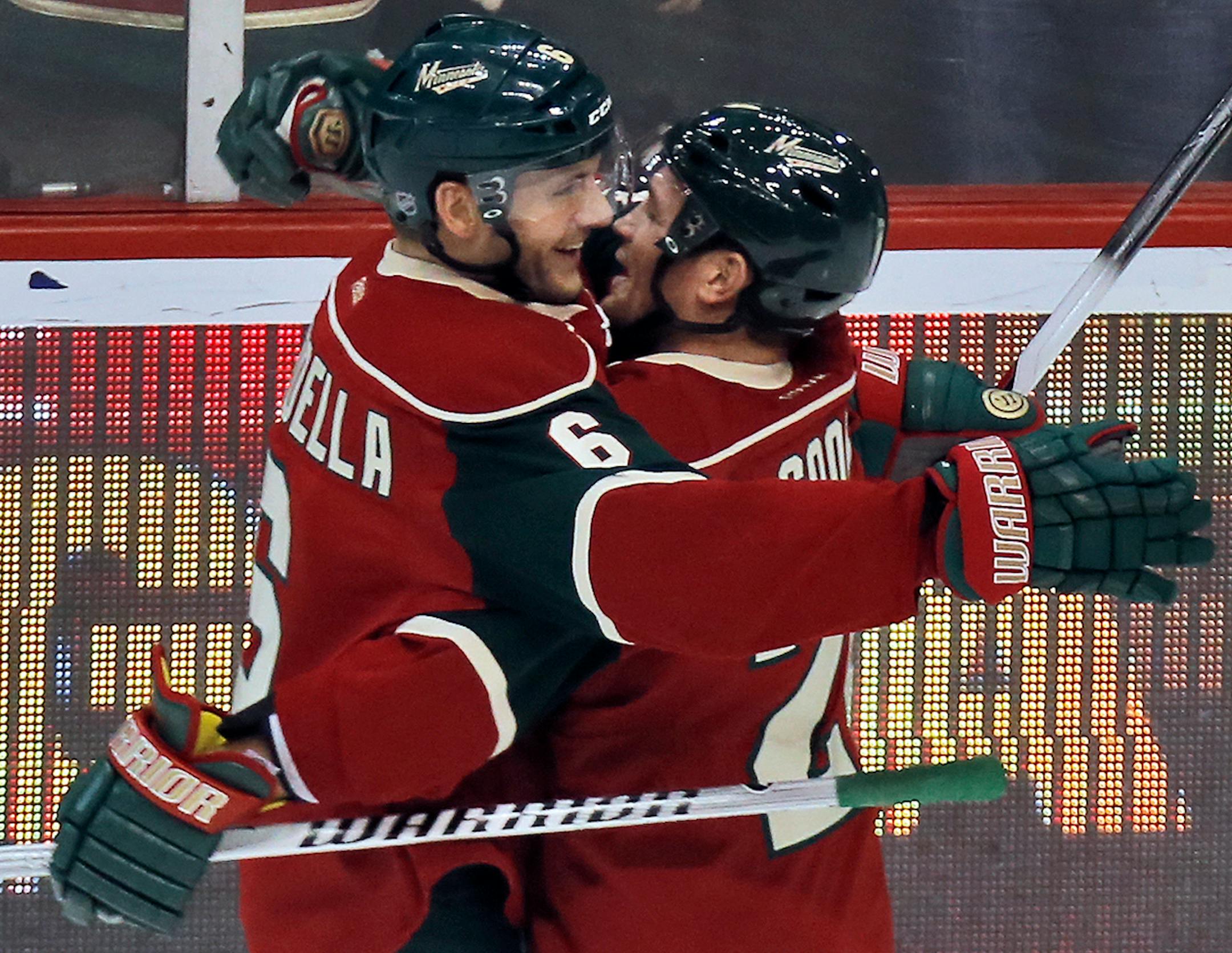Marco Scandella and Matt Cooke celebrate after Scandella scored a 2nd period goal against Buffalo.