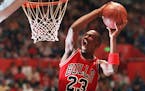 FILE -- Chicago Bulls' Michael Jordan takes part in the NBA All-Star Slam Dunk contest in Seattle in this Feb. 7, 1987 photo. Jordan, regarded as the 