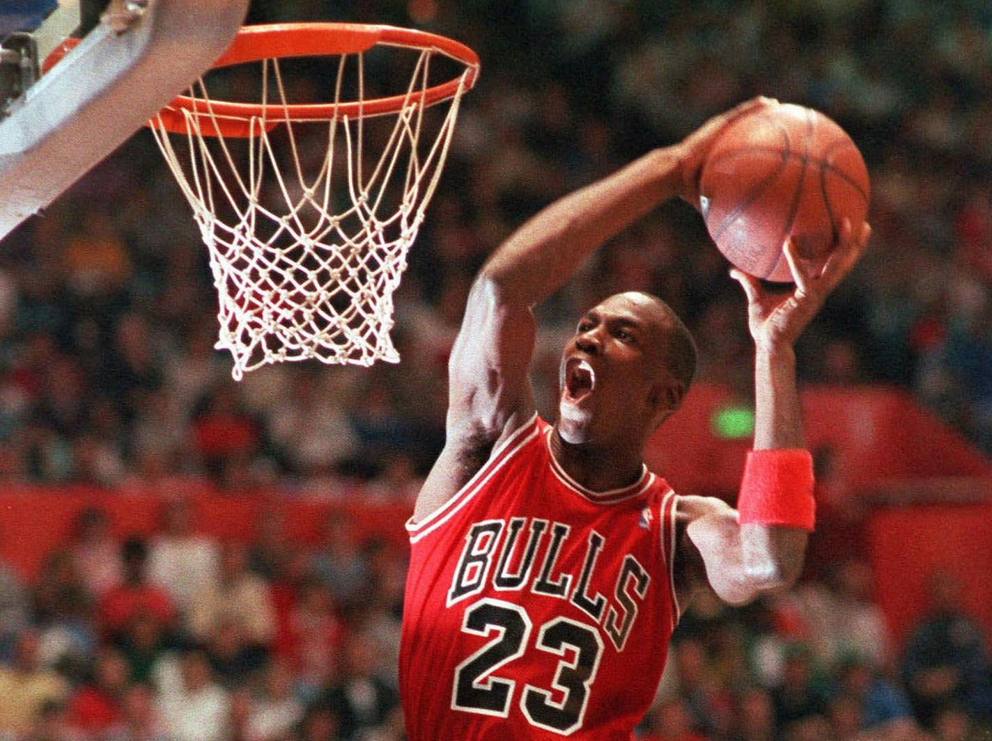 FILE -- Chicago Bulls' Michael Jordan takes part in the NBA All-Star Slam Dunk contest in Seattle in this Feb. 7, 1987 photo. Jordan, regarded as the greatest player and greatest draw in NBA history, will announce his retirement from the Bulls on Wednesday, Jan. 13, 1999, The Associated Press has learned. (AP Photo/Kirthmon Dozier)