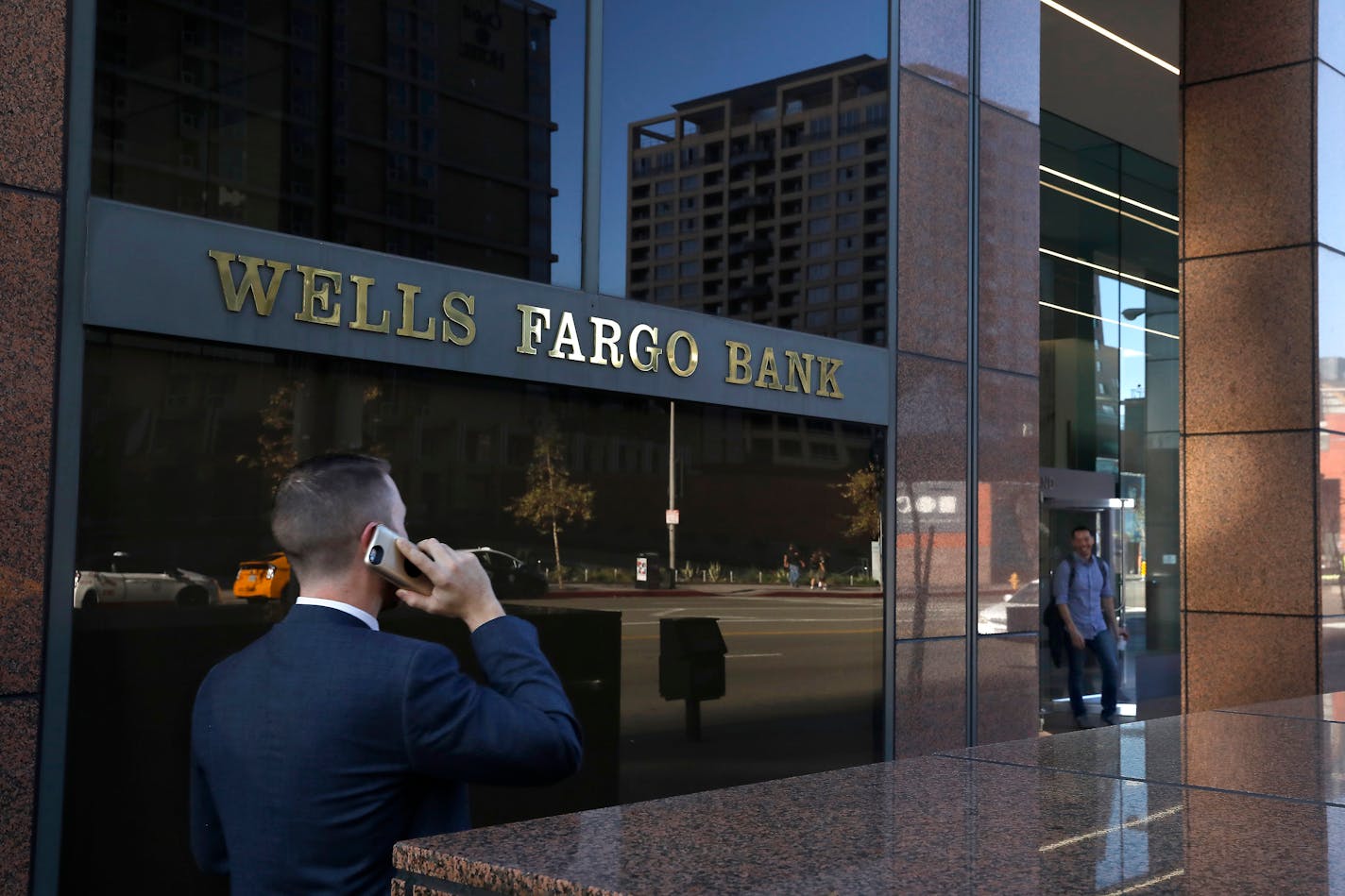 A pedestrian walks past a Wells Fargo bank in downtown Los Angeles on Feb. 5, 2018. (Mel Melcon/Los Angeles Times/TNS)