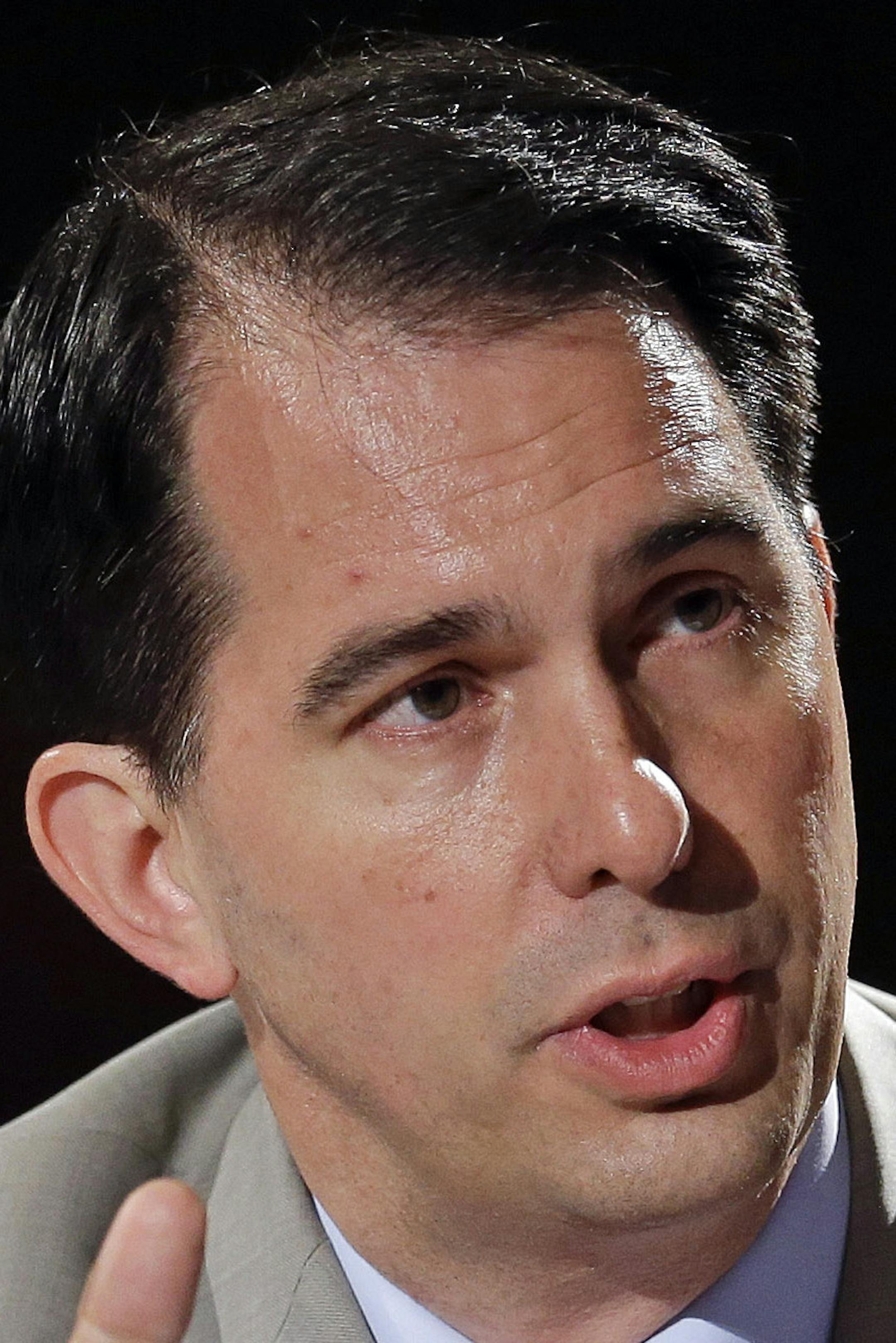 Wisconsin Gov. Scott Walker speaks during a meeting on jobs and education at the National Governors Association convention Saturday, July 12, 2014, in Nashville, Tenn. (AP Photo/Mark Humphrey)