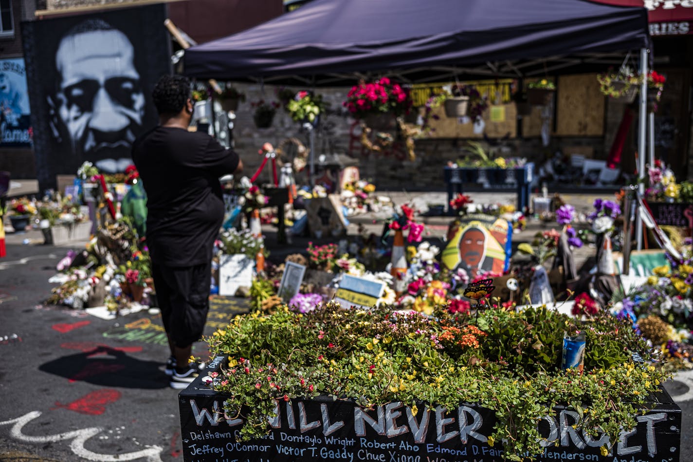 The George Floyd memorial site at 38th Street and S. Chicago Avenue in Minneapolis. With Floyd's family leading a moment of silence, this week's Democratic National Convention is intended to showcase the party's commitment to racial justice.