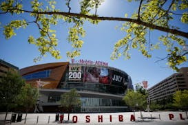 In this June 17, 2016 photo, an advertisement plays on a screen at the T-Mobile Arena in Las Vegas. A National Hockey League plan to expand to Las Veg