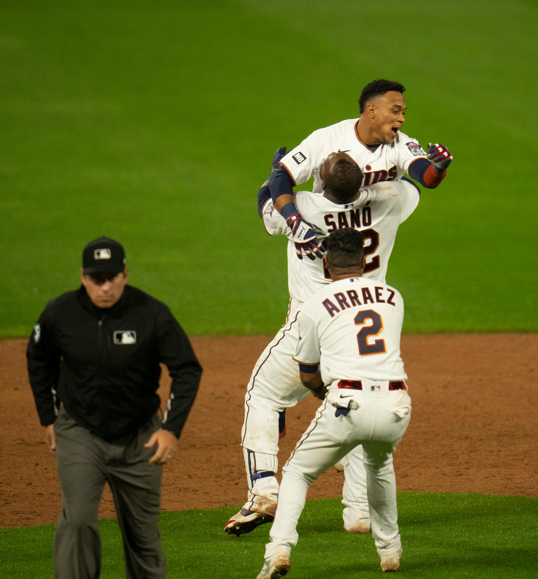Minnesota Twins first baseman Miguel Sano (22) hoisted designated hitter Jorge Polanco (11) up after Polanco hit the ninth inning walk off single to give the Twins the win.