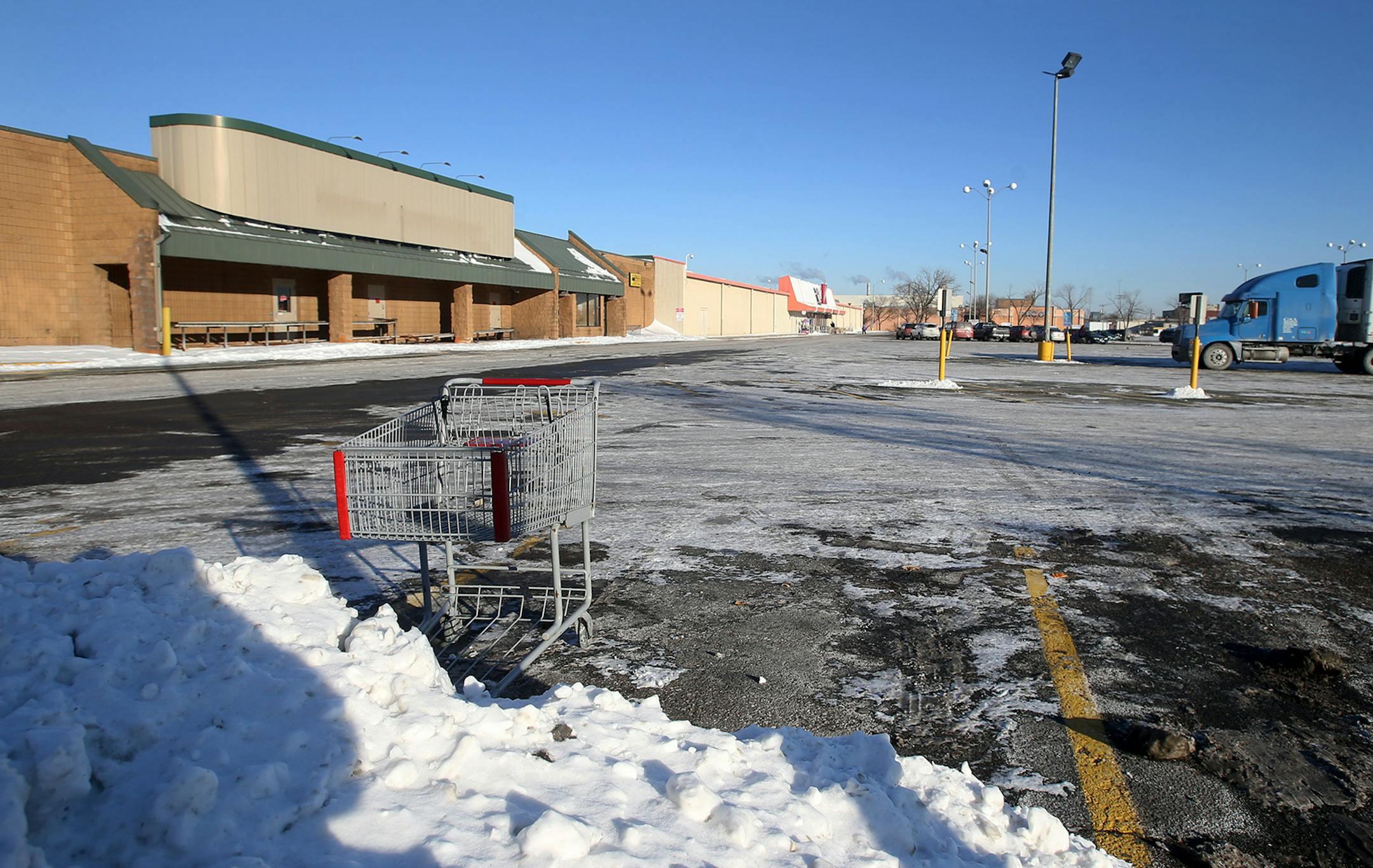 The site for a potential developer for Walgreens, which now houses a shuttered Supervalu and parking lot, left, seen Tuesday, Jan.13, 2015, in Minneapolis, MN.](DAVID JOLES/STARTRIBUNE)djoles@startribune.com A developer for Walgreens is buying a key part of the Kmart site on Nicollet Avenue, throwing a curve ball at city officials trying to reopen the intersection.