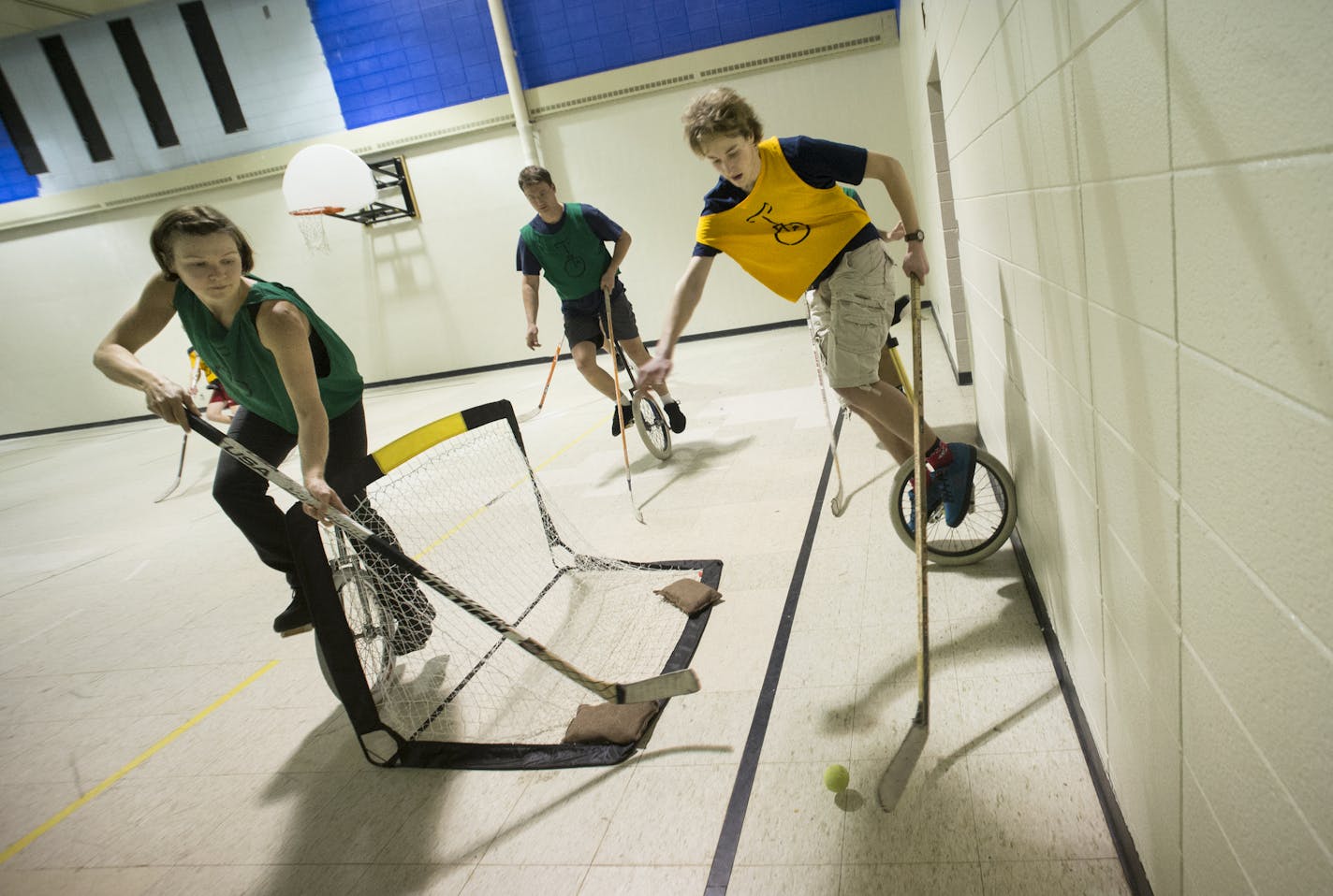 Irene Genelin, guarded the goal as Bruce Lee tried to move himself into scoring position during a unicycle hockey match on Sunday, Jan. 24 at St. Matthew's Church in Columbia Heights. ] (AARON LAVINSKY/STAR TRIBUNE) aaron.lavinsky@startribune.com Minneapolis is home to some of the best unicyclists in the world. Who knew? Meet the zany members of the Twin Cities Unicyclists Club who practice year-round - playing unicycle hockey and basketball, juggling, unicycle racing and more. We photograph the