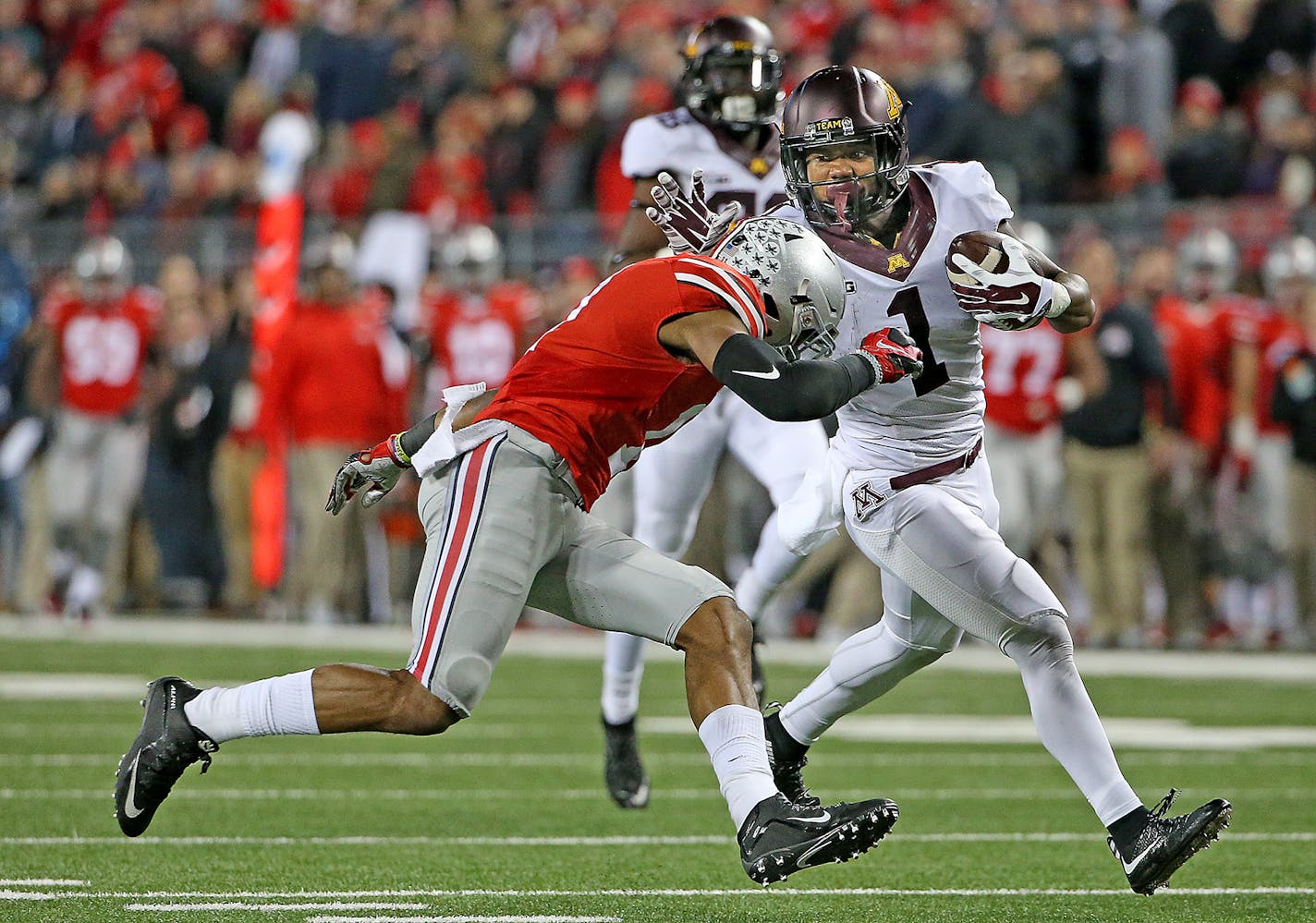 Minnesota's wide receiver KJ Maye carried the ball for more than 50 yards before he was stopped by Ohio State's safety Vonn Bell in the fourth quarter.