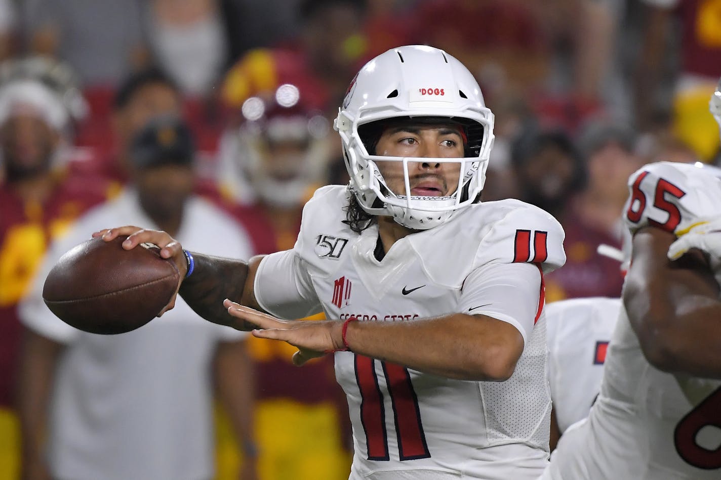 Fresno State quarterback Jorge Reyna passes during the first half of an NCAA college football game against Southern California Saturday, Aug. 31, 2019, in Los Angeles. (AP Photo/Mark J. Terrill)