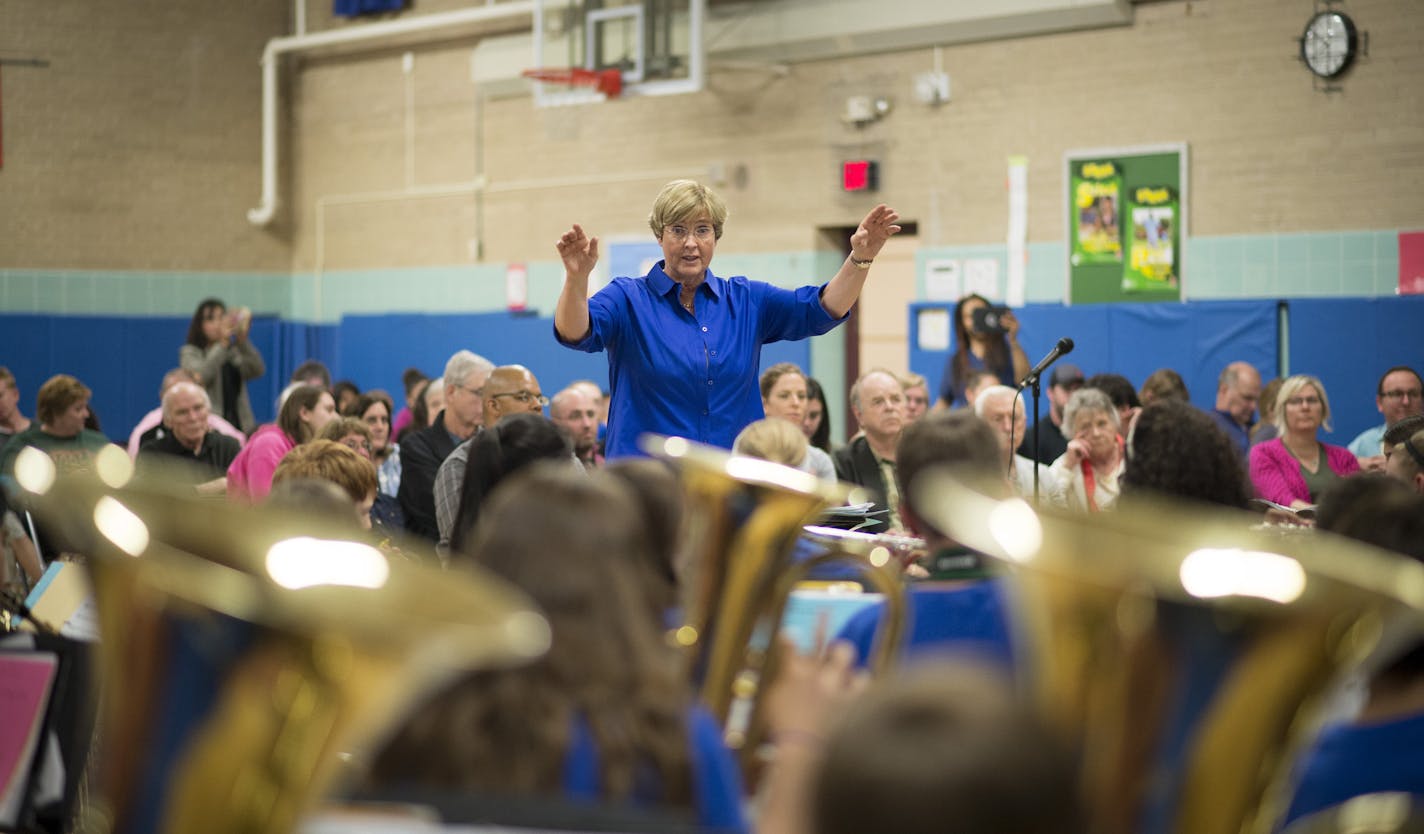 Kay Hawley conducted her 6th graders in a concert on Tuesday night. ] (Aaron Lavinsky | StarTribune) aaron.lavinsky@startribune.com Kay Hawley, a Hopkins music teacher, is retiring after 42 years. Recently, the district invited back some of her former students for a concert to give her a Mr. Holland's Opus type send off. The concert was held Tuesday, May 5, 2015 at Glen Lake Elementary in Minnetonka.