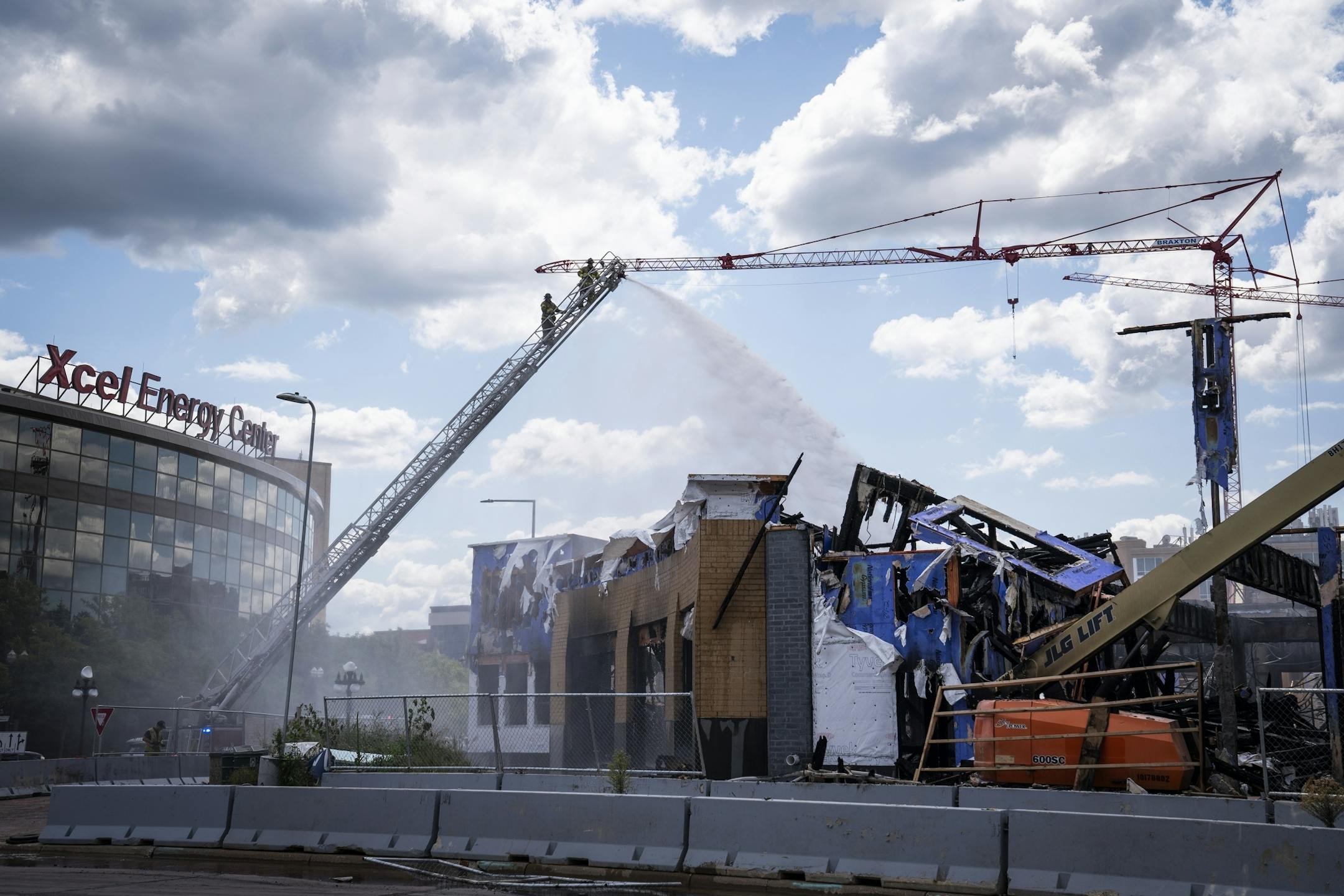 St. Paul firefighters battled a fire at a construction site across from Xcel Energy Center in downtown St. Paul.