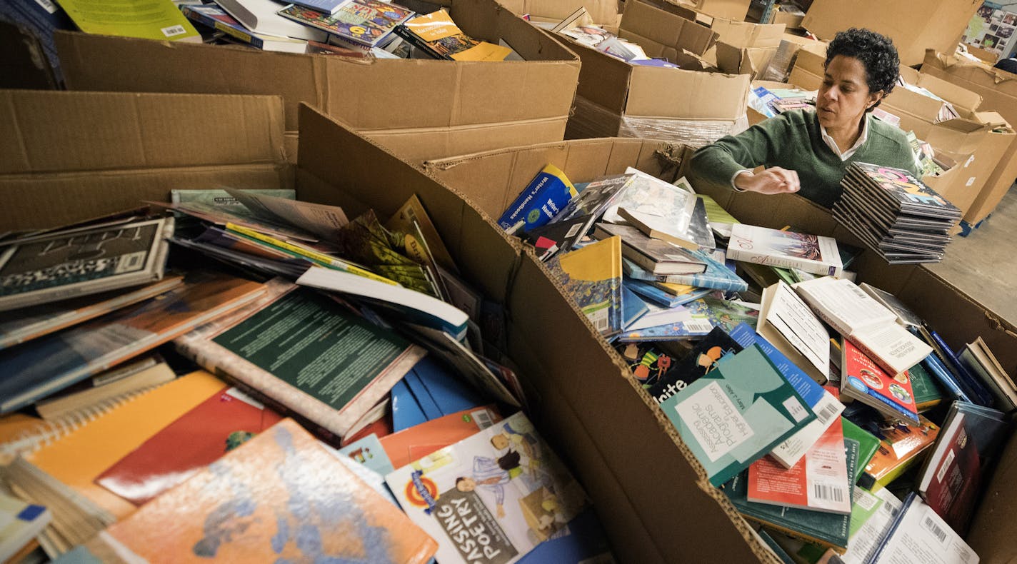 Marla Butler of Plymouth sorted books at Books for Africa in St. Paul. ] CARLOS GONZALEZ &#xef; cgonzalez@startribune.com - December 14, 2017, St. Paul, MN,
It was 30 years ago that Minnesotan and world traveler Tom Warth, shocked at what he called a book famine in Africa, shipped several mailbags of used books to overseas libraries and schools.
That modest gesture grew into St. Paul-based Books for Africa, one of the state's more recognizable charities