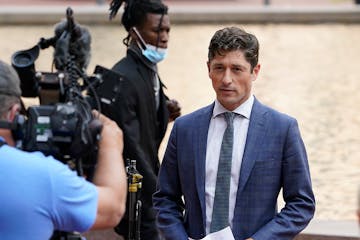 Mayor Jacob Frey addressed media members outside the Hennepin County Government Center during a news conference in August.