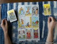 Jessica Dore's tarot cards placed in rows of three on her table on Aug. 6, 2019 in Germantown, Pa. (ANthony Pezzotti/The Phildelphia Inquirer/TNS)