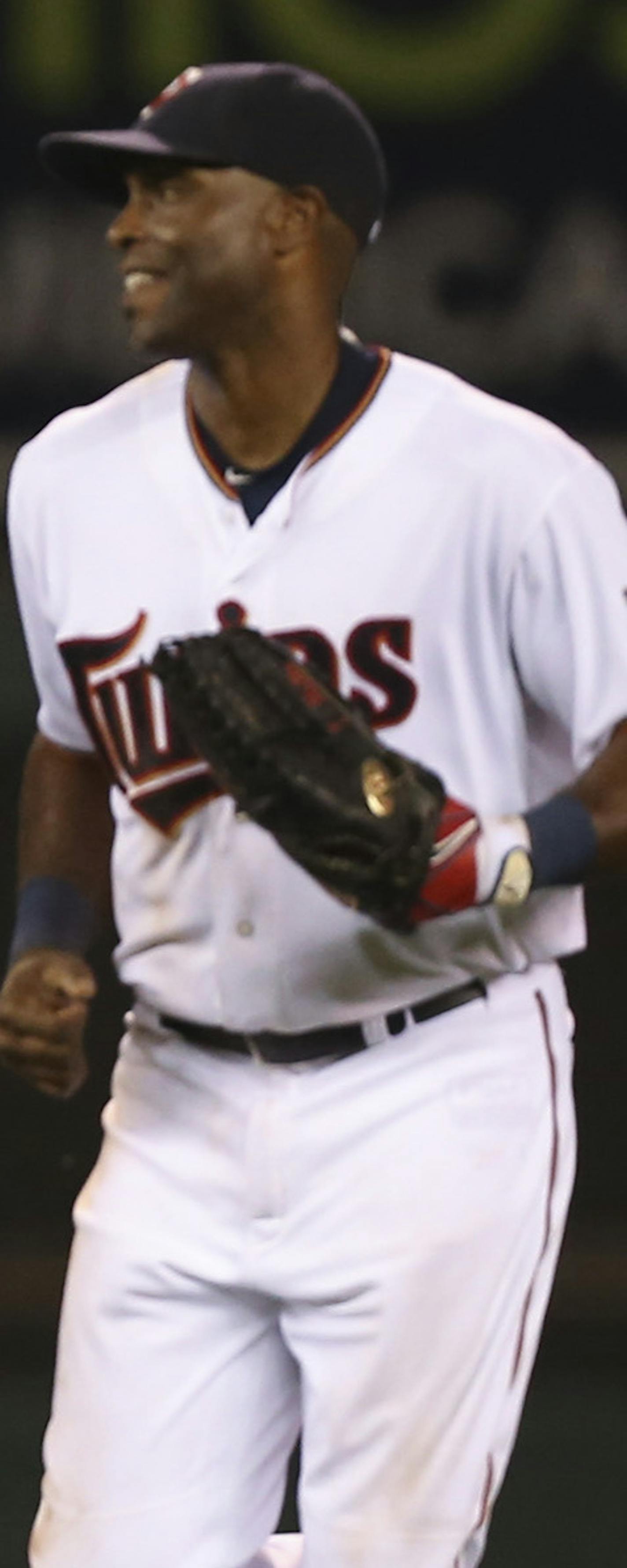 Twins left fielder Eddie Rosario, left, and right fielder Torii Hunter as they ran in at the end of the game Thursday night. ] JEFF WHEELER &#xef; jeff.wheeler@startribune.com The Minnesota Twins began a series with the Seattle Mariners with a 9-5 win Thursday night, July 30, 2015 at Target Field in Minneapolis. ORG XMIT: MIN1507302244060559