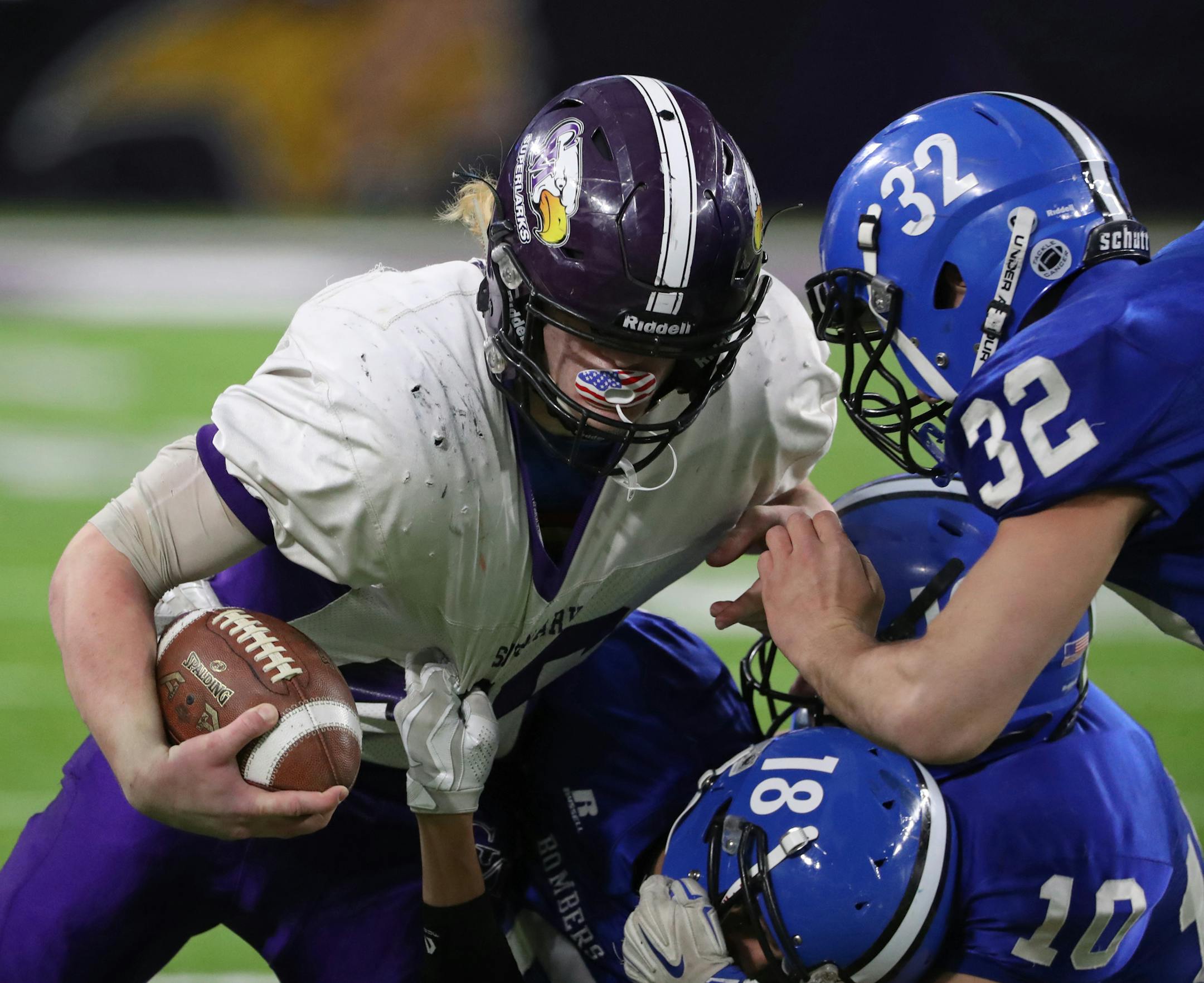 Christophor Bain of Grand Meadow rumbled ahead against a wall of Waubun players in the first half. ] Shari L. Gross / sgross@startribune.com Grand Meadow versus Waubun in a Minnesota State High School football semifinal game at U.S. Bank Stadium on Friday, November 18, 2016 in Minneapolis, Minn.