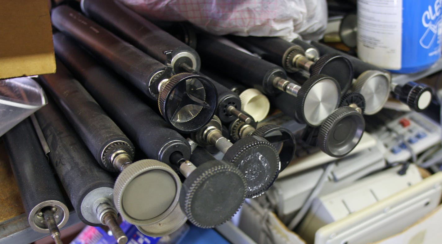 Rollers and other typewriter parts sit stacked up in Mark Soderbeck's shop.