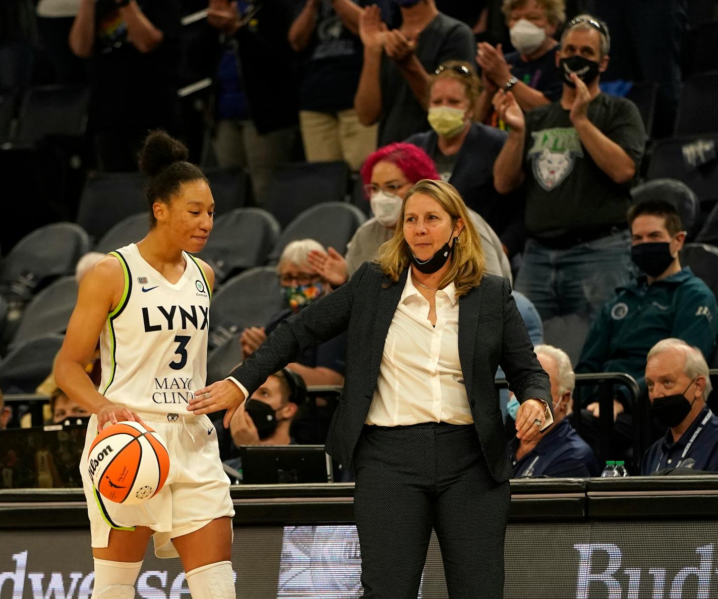 In the waning seconds of the game Minnesota Lynx guard Aerial Powers dribbled the ball while getting a pat from head coach Cheryl Reeve during the Lynx 90-80 win over the Indiana Fever at the Target Center Sunday in Minneapolis. ]