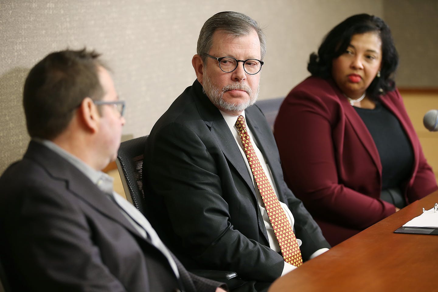 U President Eric Kaler, center, along with search committee co-chairs Perry Leo, left, and Katrice Albert, right, addressed the media during a press conference at McNamara Alumni Center, Wednesday, March 23, 2016 in Minneapolis, MN.