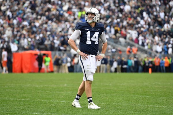 Penn State quarterback Sean Clifford (14) reacted after a missed two-point conversion in overtime against Illinois last week.