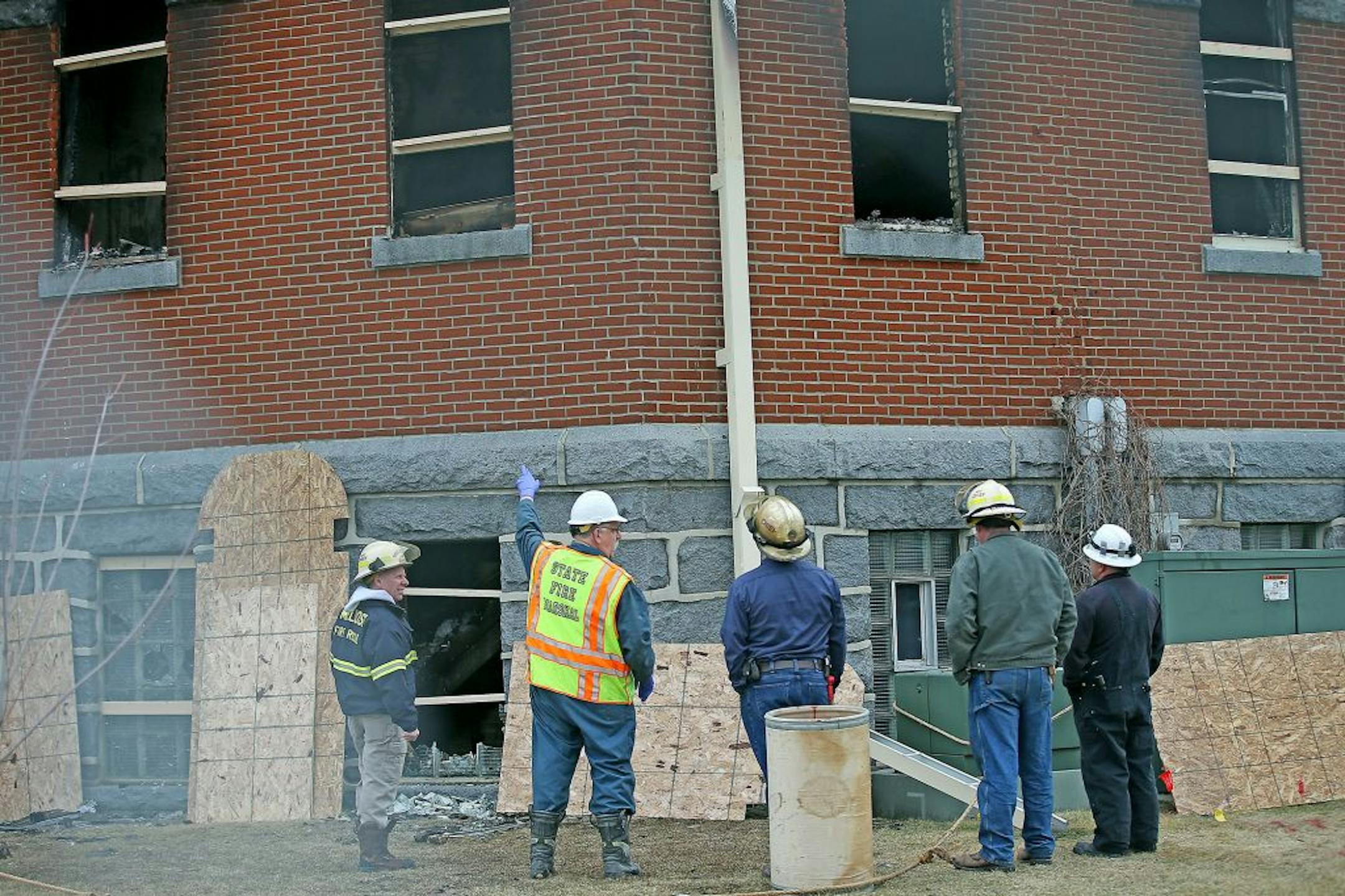 Local fire and federal agents arrived to inspect the scene where a fire damaged about 30 percent of the 120-year-old St. Mary's Catholic Church, Monday, March 14, 2016 in Melrose, MN.