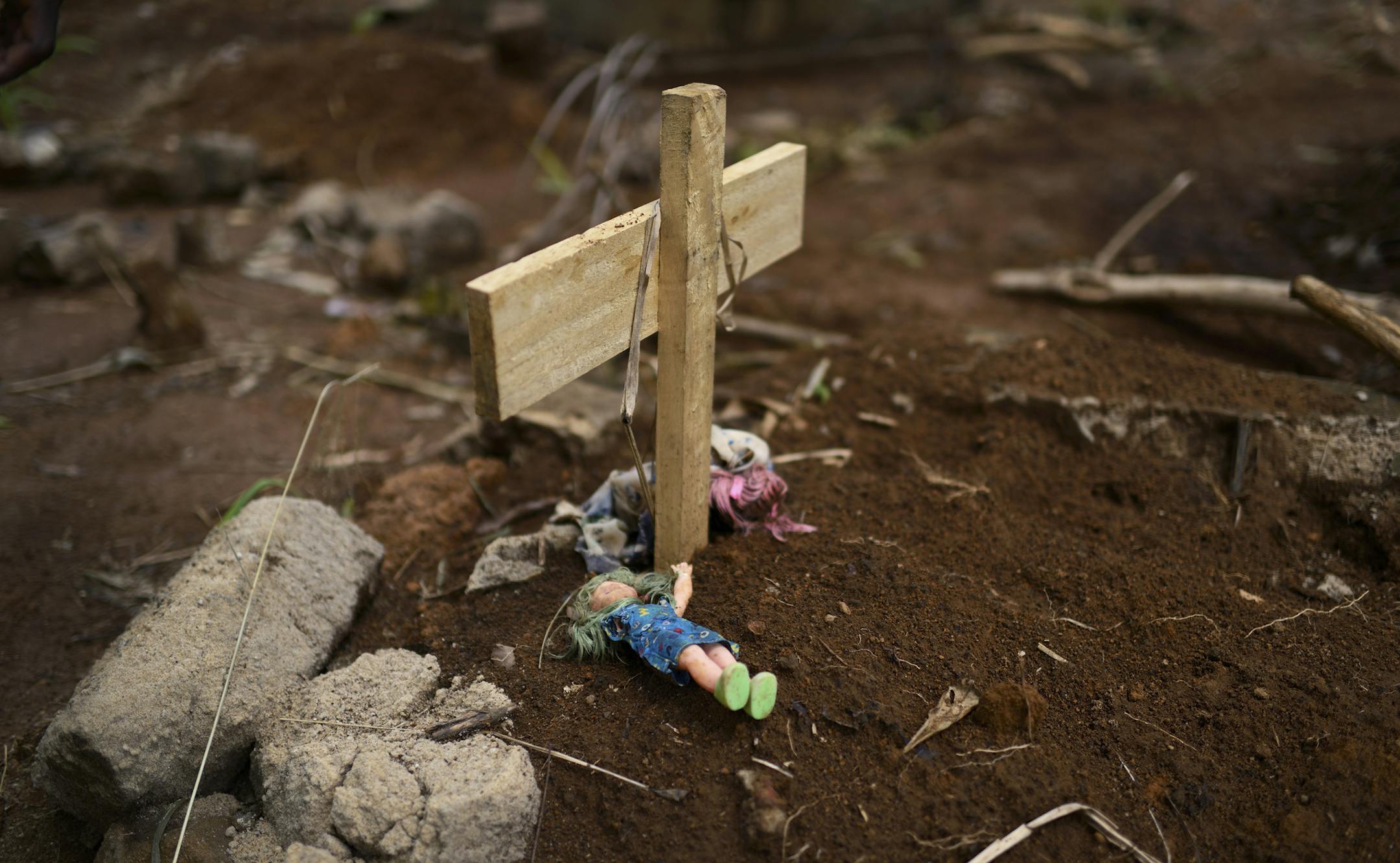 The grave of a Marian Sebay, a nurse and victim of Ebola, at King Tom Cemetery, adjoining a slum called Kolleh Town by its residents, in Freetown, Sierra Leone, Sept. 21, 2014. On Sunday, the government was wrapping up an ambitious national lockdown in an attempt to fight the epidemic, having ordered Sierra Leone‚Äôs citizens to stay home for three days to receive warnings about Ebola, and soap from volunteers. (Samuel Aranda/The New York Times)