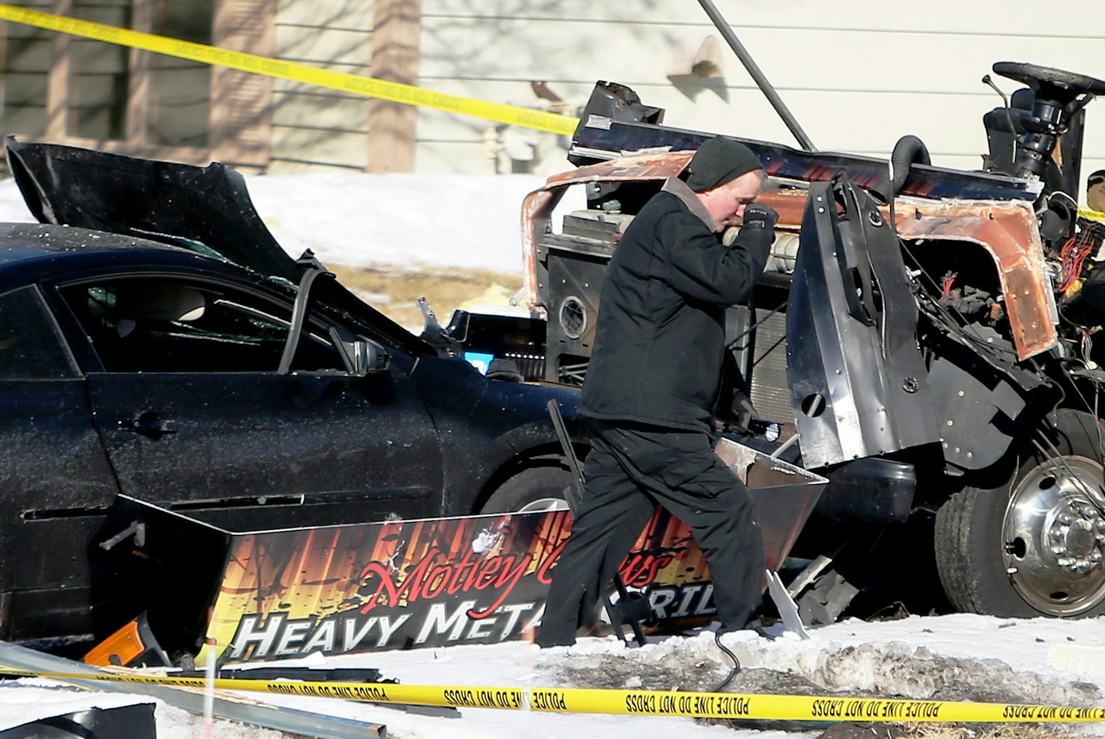 An investigator walks in the rubble that was the aftermath of a food truck explosion in Lakeville that happened late Friday night and was seen in the 16500 block of Joplin Path Saturday, March 7, 2015, in Lakeville, MN](DAVID JOLES/STARTRIBUNE)djoles@startribune.com Police responded to the scene on the 16500 block of Joplin Path around 11:30 p.m. after a loud boom erupted on the block. Photos posted on social media by neighbors show scraps of metal strewn across yards and driveway and some damag