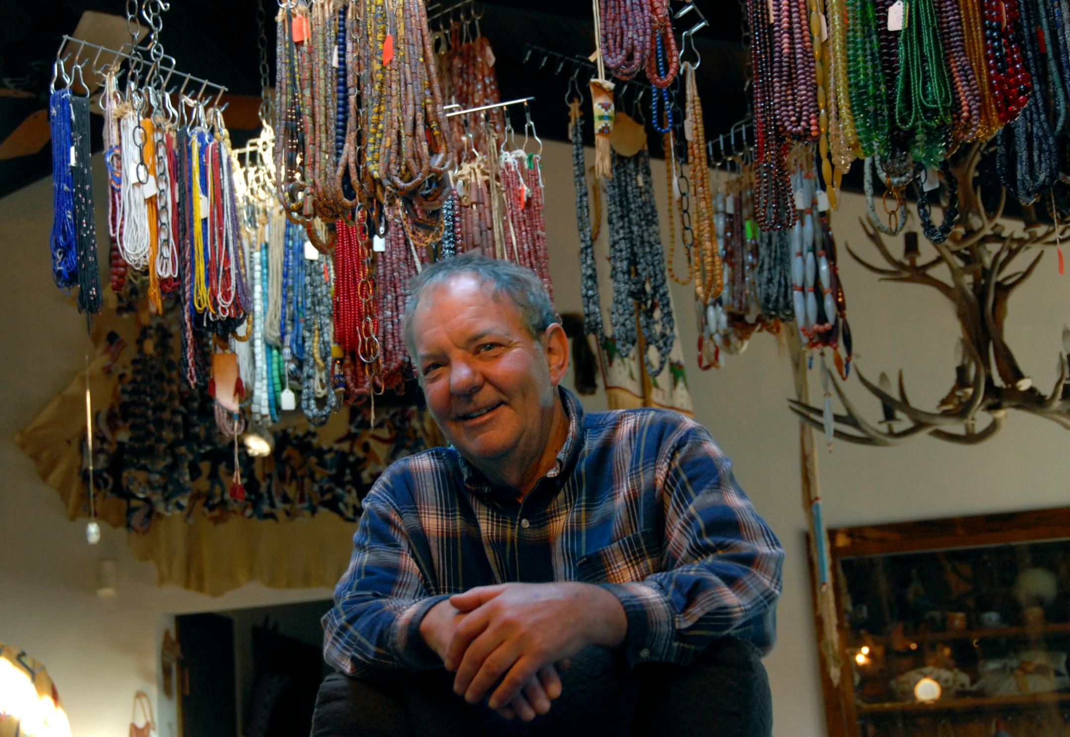 Jim Rosenwald, in his house with Venetian glass beads hanging from the ceiling. "Money didn't mean anything to native people," Rosenwald said of the beads. "There needed to be something the Europeans could trade to the locals to get what they wanted."