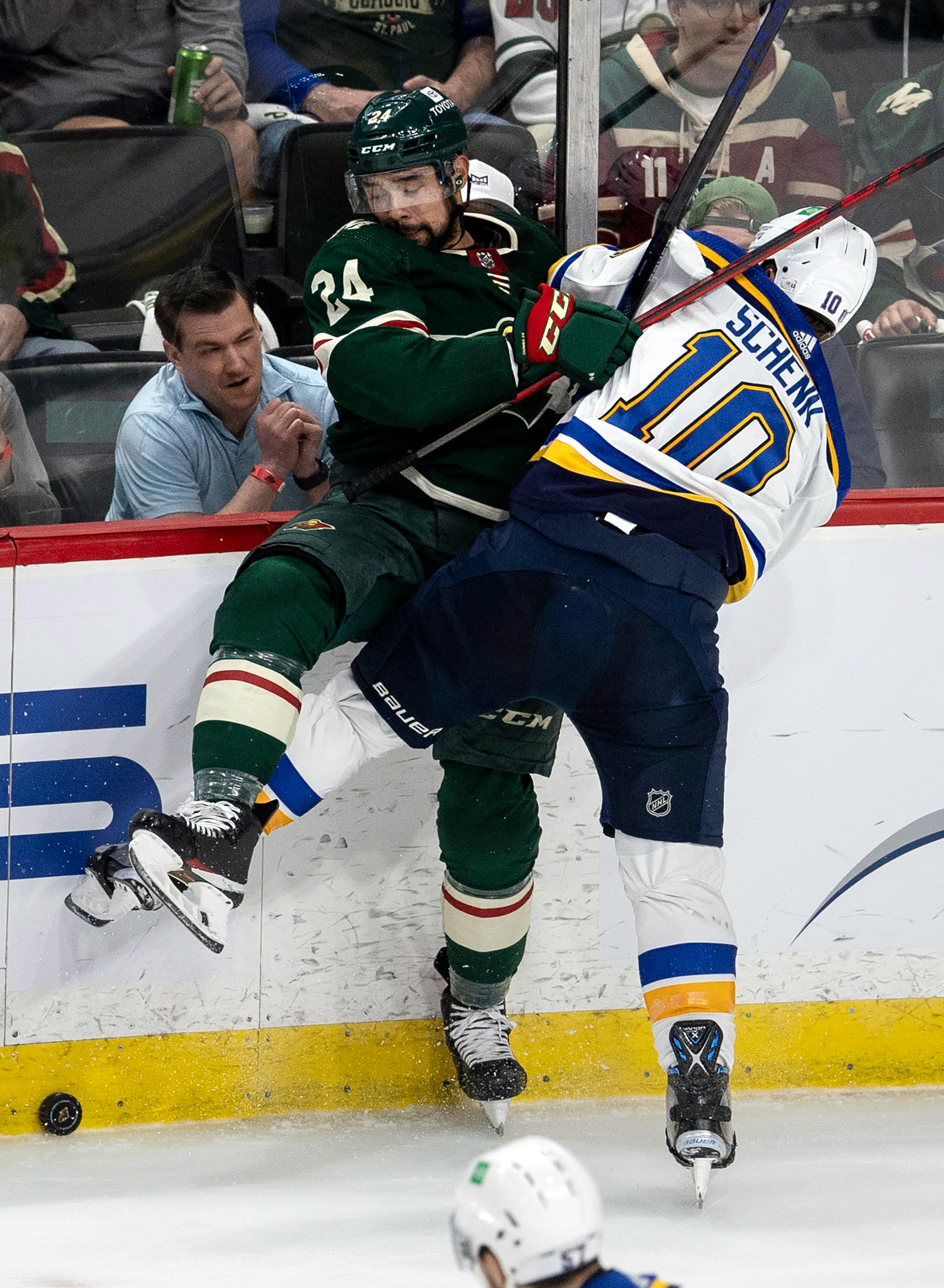 Matt Dumba (24) of the Minnesota Wild and Brayden Schenn (10) of the St. Louis Blues collide in the second period.