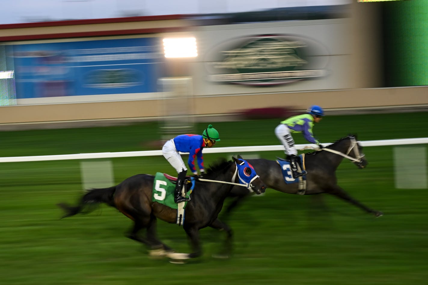 Jockeys and their horses race Wednesday, Aug. 16, 2023 at Canterbury Park in Shakopee, Minn. ] AARON LAVINSKY • aaron.lavinsky@startribune.com