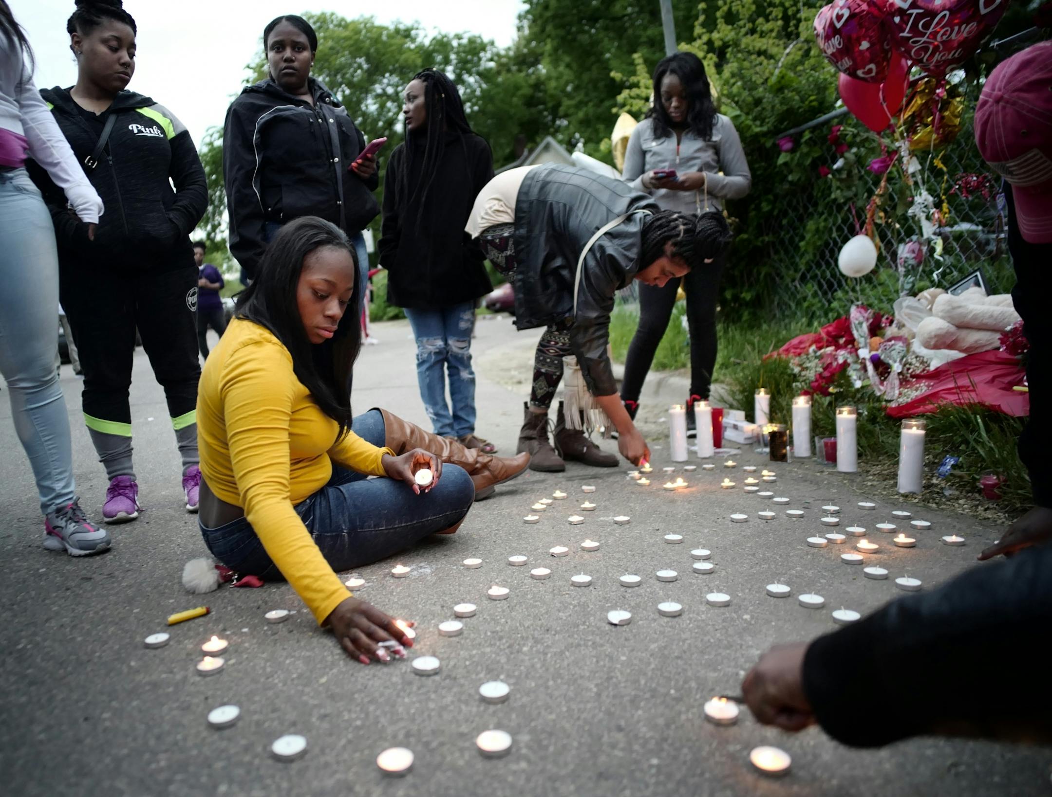 On 5/12/16, an impromptu memorial of balloons and flowers on a service road off Olson Memorial Highway near the spot where Derrick Rodgers fell, to mourn the loss of the 25-year-old Minneapolis man who was gunned down earlier this month.