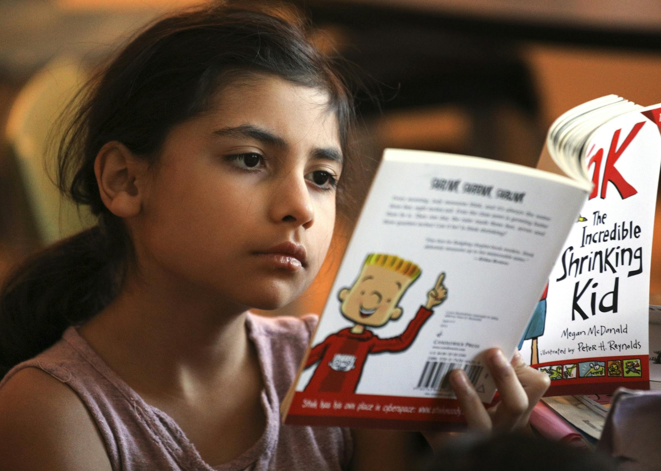 Students in Katie Bigham's second-grade class at Green Central Park Elementary, where they're in a Friday literacy block, Here, Anisa, was reading in class. ] BRIAN PETERSON • brian.peterson@startribune.com
Minneapolis, MN 02/02/18