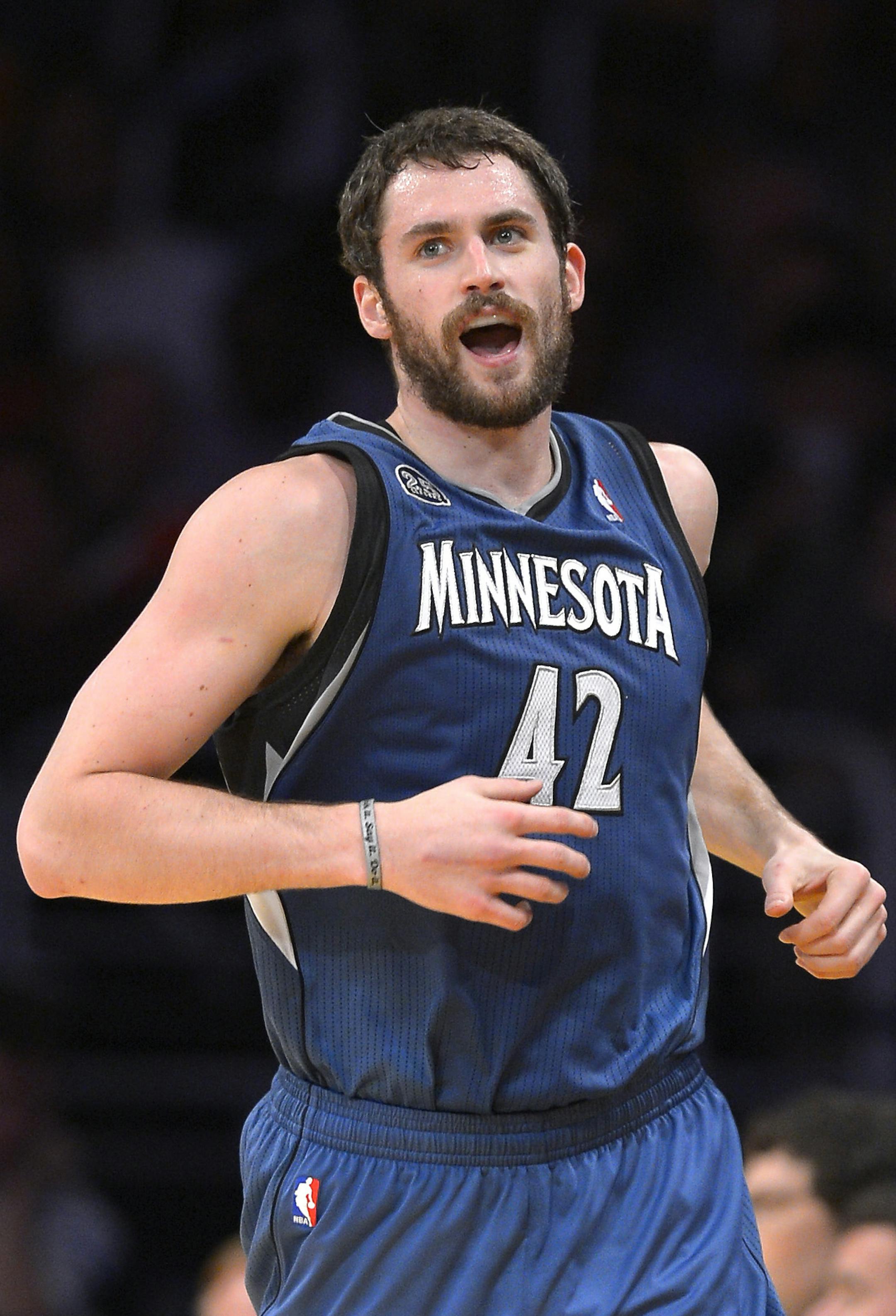 Minnesota Timberwolves forward Kevin Love looks on after scoring during the first half of an NBA basketball game against the Los Angeles Lakers, Sunday, Nov. 10, 2013, in Los Angeles. (AP Photo/Mark J. Terrill) ORG XMIT: NYOTK