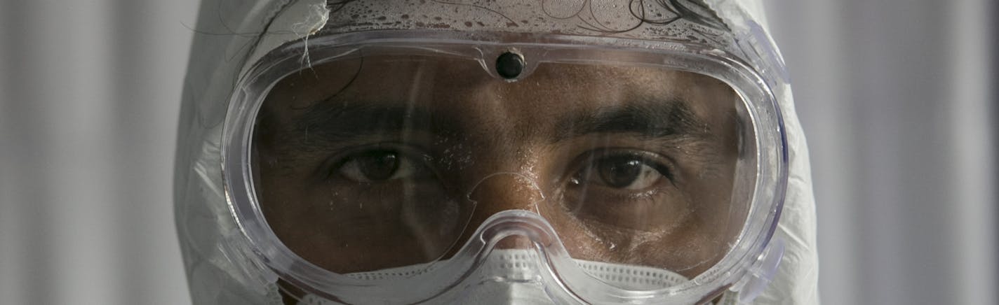 Dr. Giorgio Franyuti at a makeshift hospital in Mexico City, June 30, 2020. Franyuti is usually in the remote jungles of Mexico diagnosing tuberculosis. But since the pandemic, he has worked at the hospital treating coronavirus patients in Mexico City. (Meghan Dhaliwal/The New York Times)